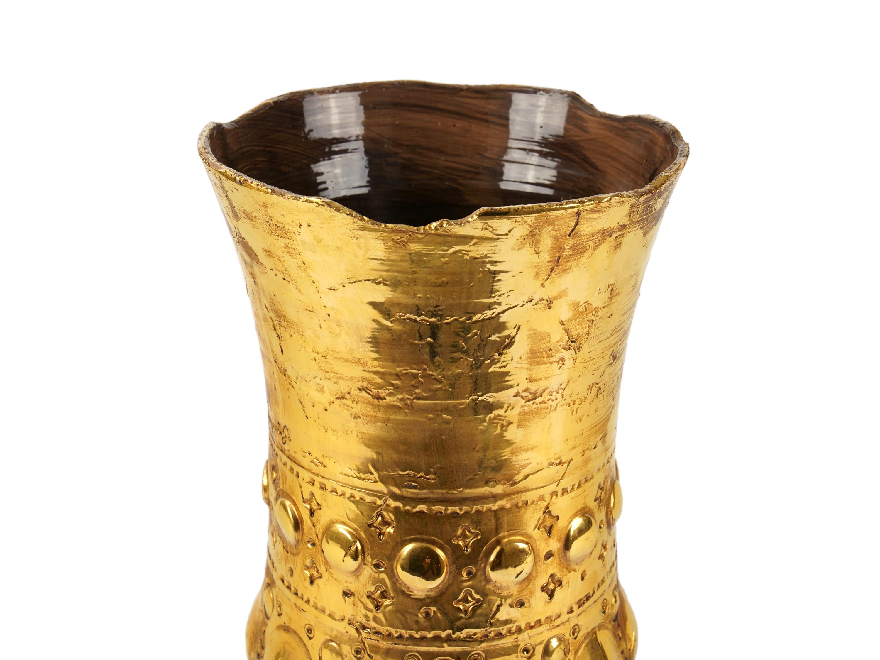 Sculptural vase handmade in Italy and decorated with the luster technique in 24 Kt gold. Dimensions: D 29 cm, H 46 cm. The entire manufacturing process is handmade in Italy.
The vase draws inspiration from one of the most characteristic products of