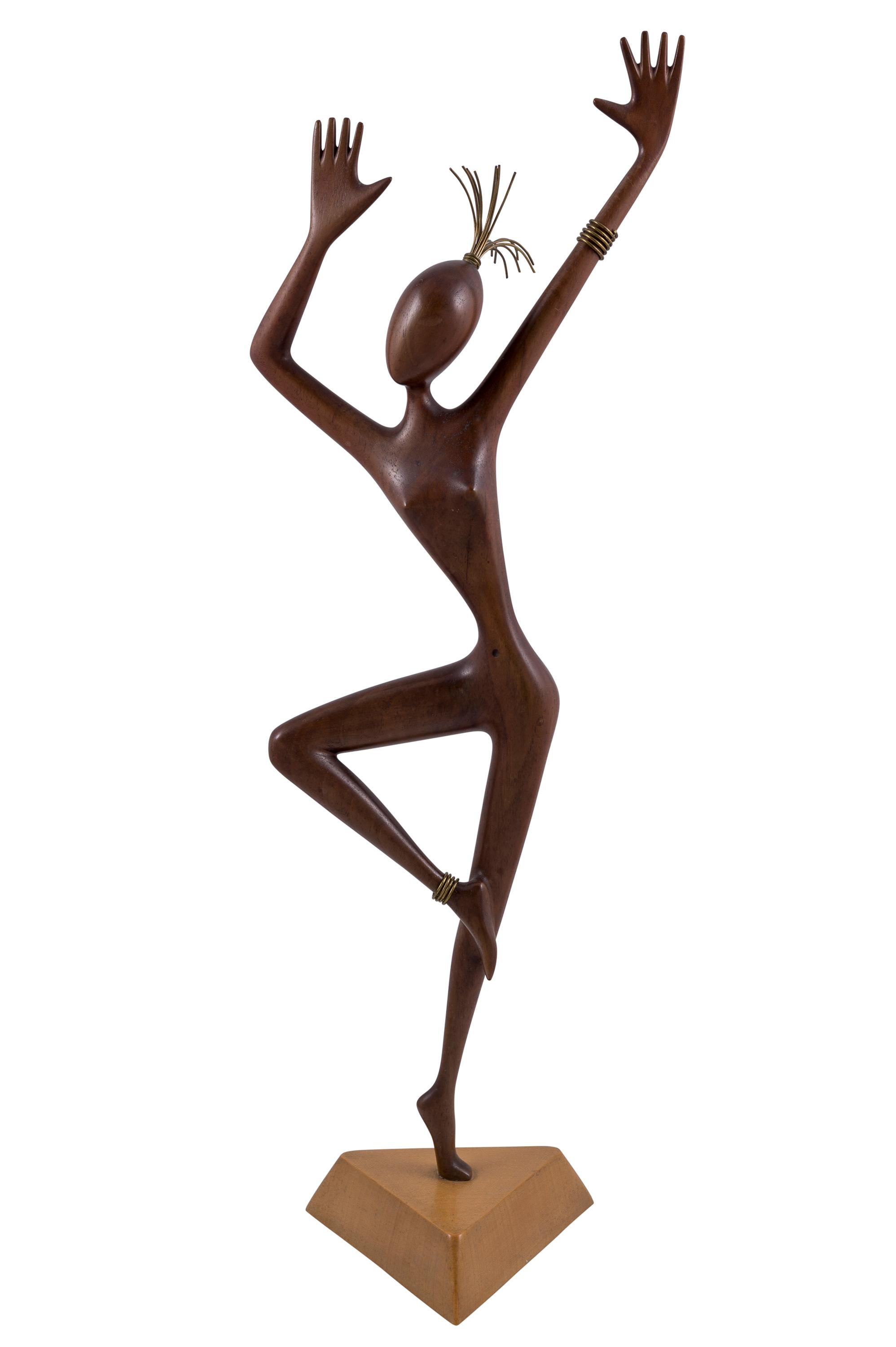 Wooden sculpture of a dancer with brass details, Werkstaette Hagenauer Wien, circa 1950

Today, the Werkstaette Hagenauer is rightfully among the most important Austrian Arts & Crafts manufacturers of the 20th century. The clear, strict formal