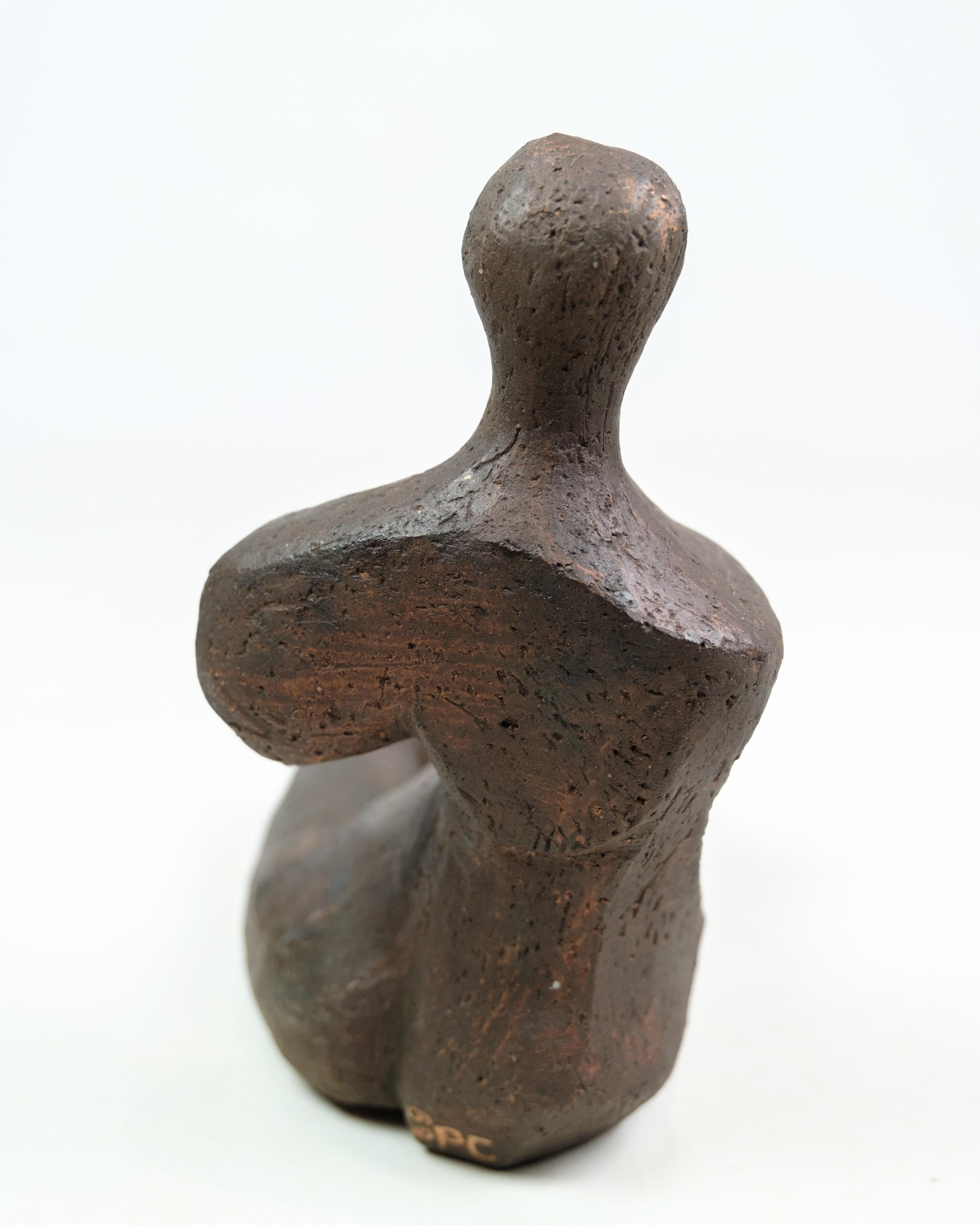 The stoneware sculpture, designed and crafted by Espen Kalmann, showcases a harmonious blend of form and texture. Kalmann's creation exudes a sense of craftsmanship and artistry, evident in the intricate details and skillful execution of the piece.