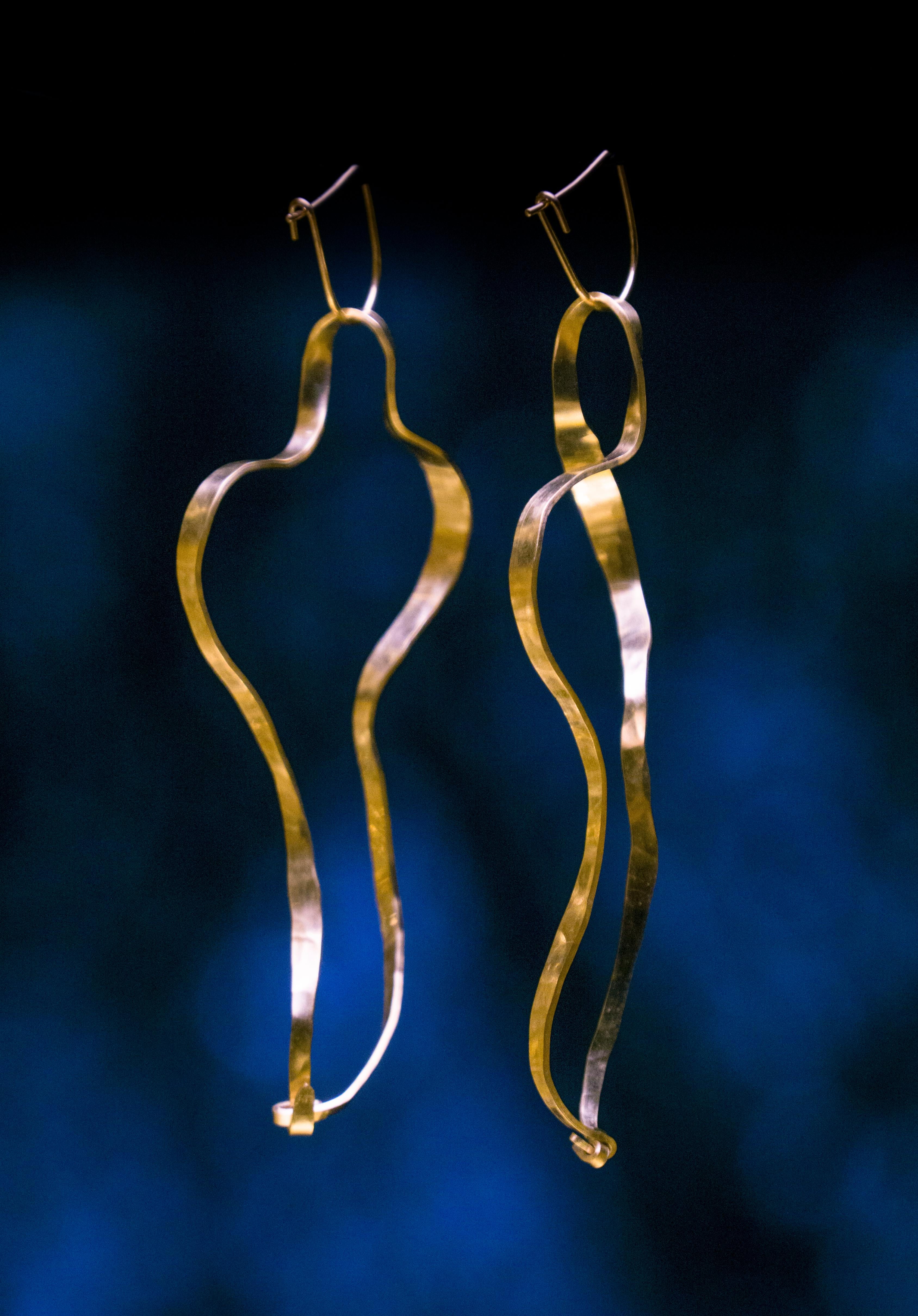 Earrings in gold plated brass by Jacques Jarrige. These timeless pieces echo his large sculptures by the same name.

Jarrige's jewelry is more companion than ornament, heightening one's physical awareness and bestowing the pleasure of inhabiting a
