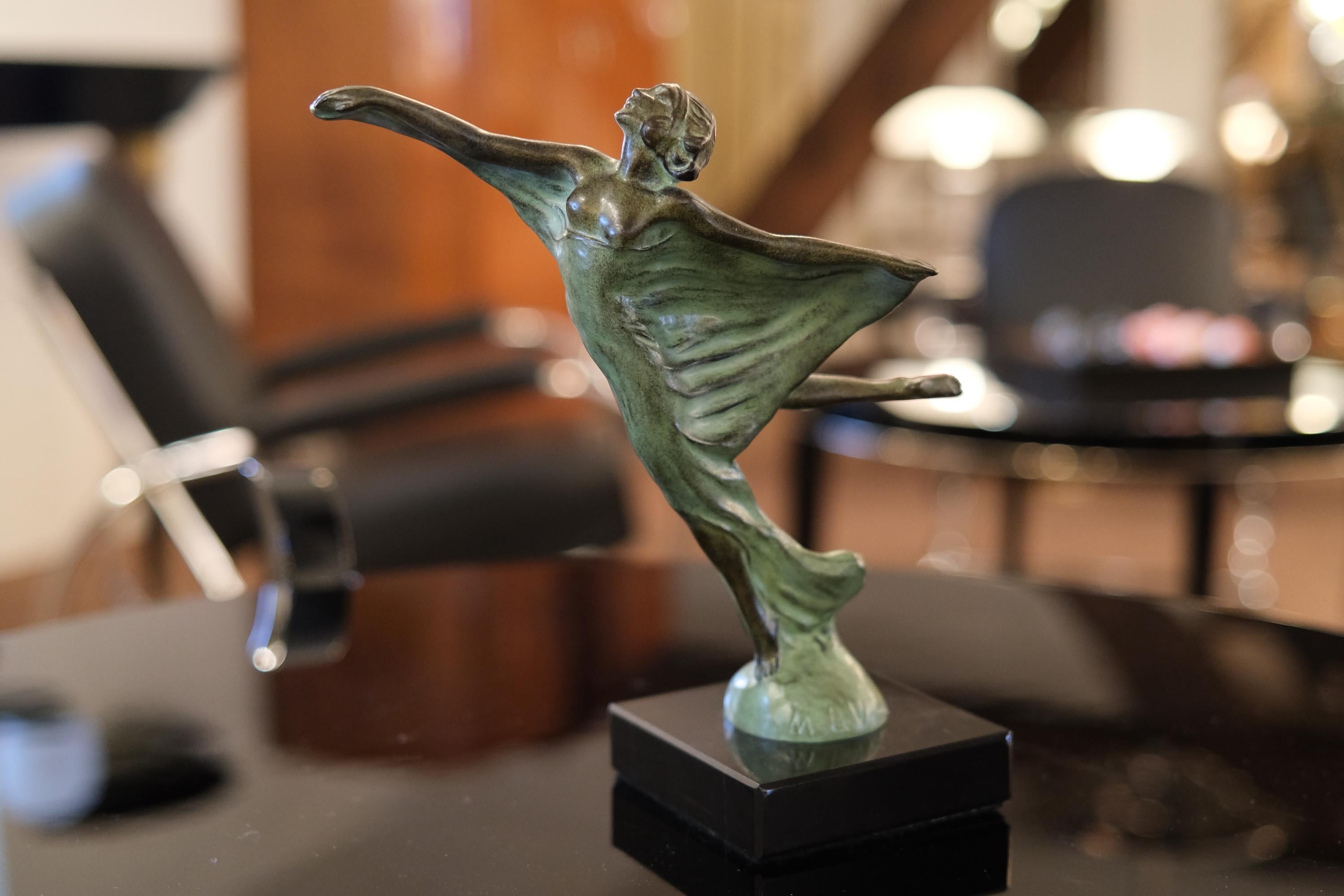 Body shape of a lady enveloped with a veil. 
Very decorative hood ornament named Envol (engl. takeoff) 
This French radiator mascot was designed during the roaring 1920s by “Max Le Verrier” himself 

Original Max Le Verrier, signed 
Art Deco style,