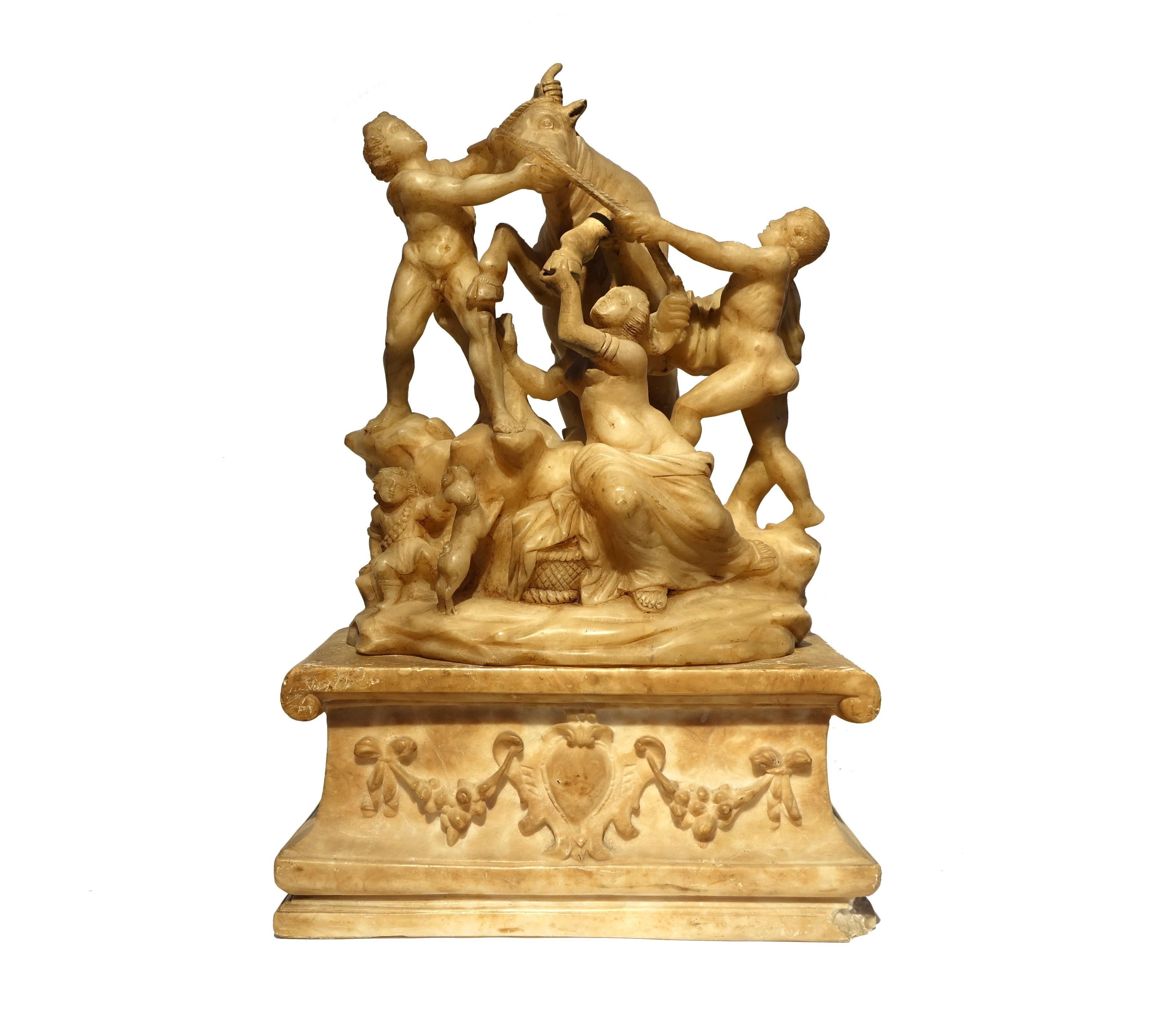 Alabaster sculpture composed of 2 elements.
The upper part derives from a reinterpretation of the Farnese Bull.
It has a nineteenth-century restoration on the left front leg of the bull that also involves the left arm of the central woman, but
