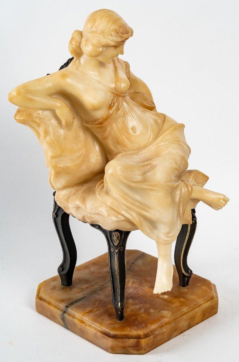 Sculpture In Alabaster Of Art Nouveau Style

Alabaster sculpture of a woman sitting on a chair in bronze with brown patina 
beautiful composition of Art Nouveau style
the sculpture rests on a yellow onyx base 
Signed Alberto Saccardi on the back of