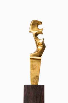 Escultura de latón y palisandro