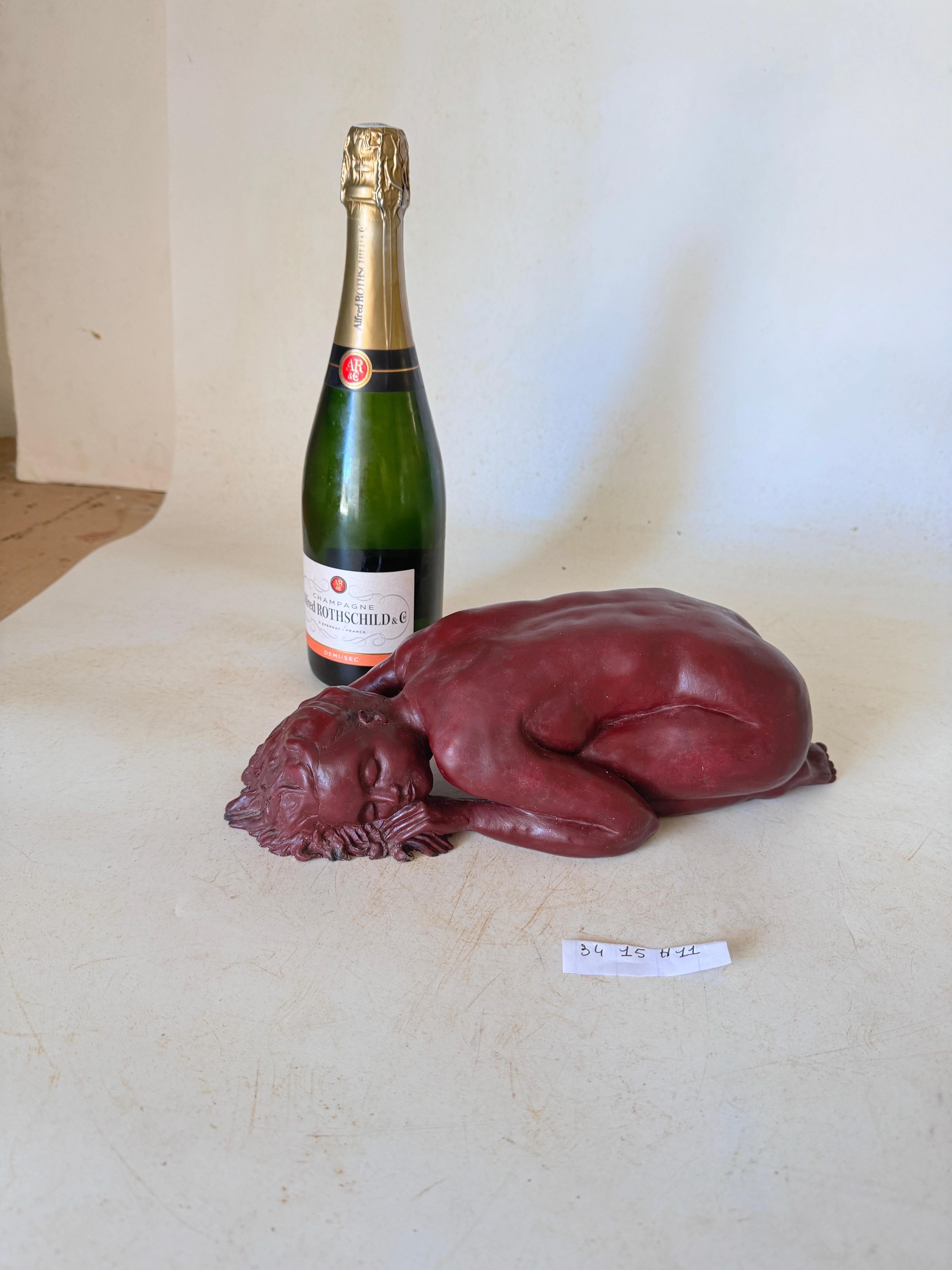 This sculpture is in clay. It has been done in France circa 1970. It is representing a naked woman lying. It is signed on the terrace. The clay has a beautiful old patina, in brown color.