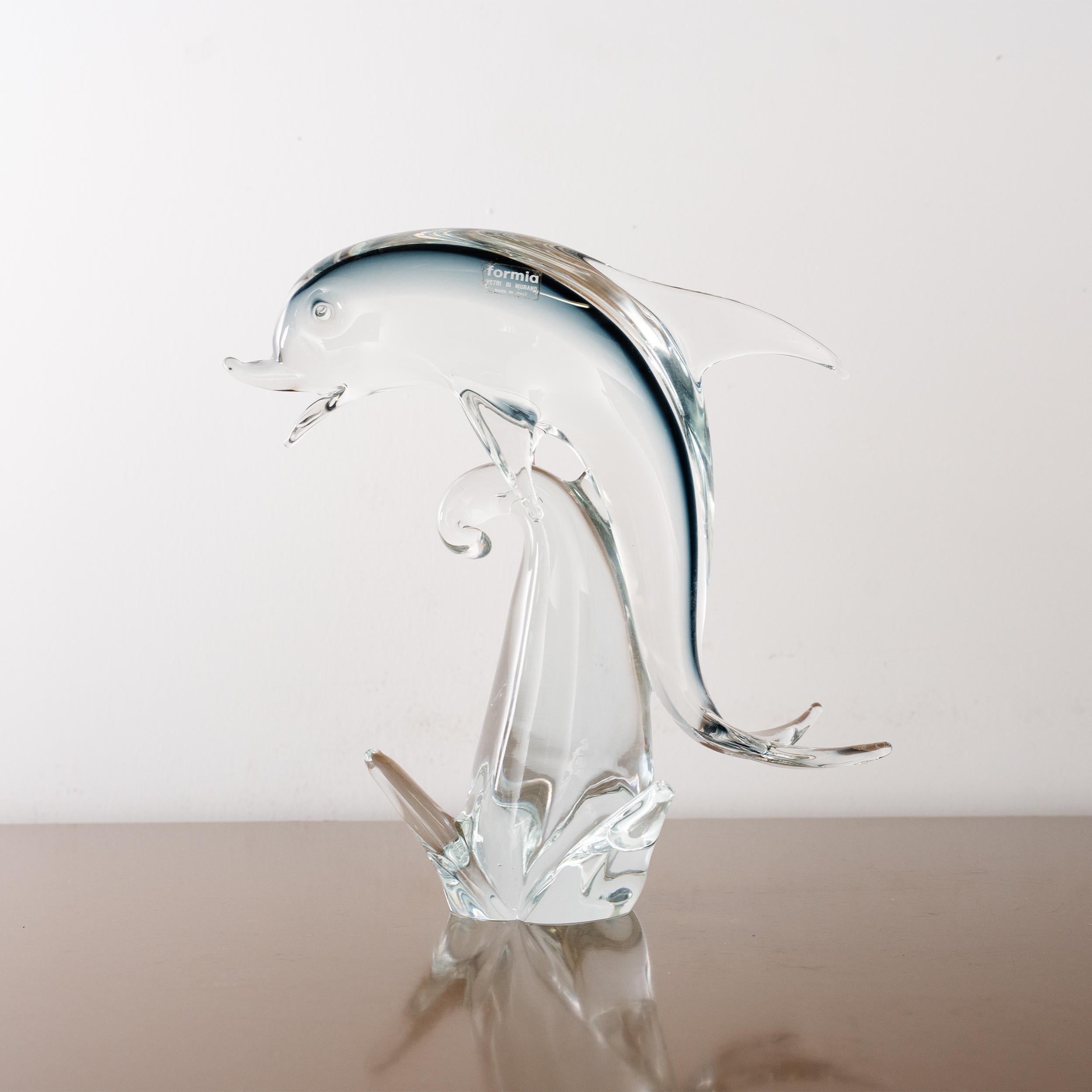 Sculpture in Murano glass, grey Dolphin with crystal details, Italy in stock

Dimensions: L 22 cm x H 28 cm x D 22 cm ( L 8.6