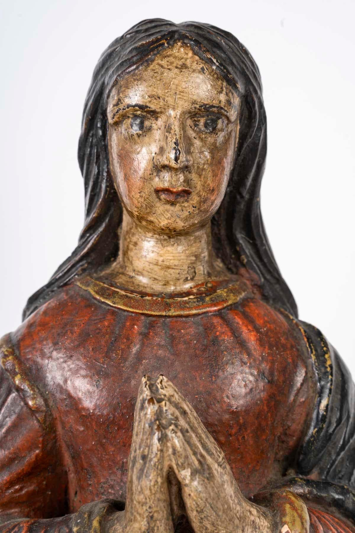 Sculpture en bois polychrome représentant Sainte Marguerite, XVIIIe siècle.

Sculpture de Sainte Marguerite en bois sculpté et polychrome, France, XVIIIe siècle.
H : 54cm, L : 22cm, P : 16cm