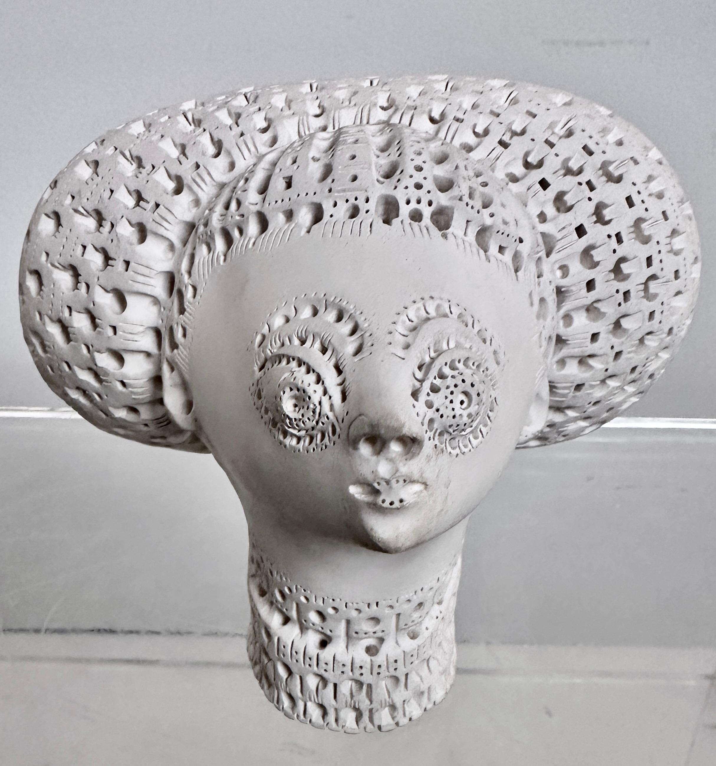 This work by celebrated artist, Alexander Ney features a woman's head with large hair decorated with Ney's characteristic 