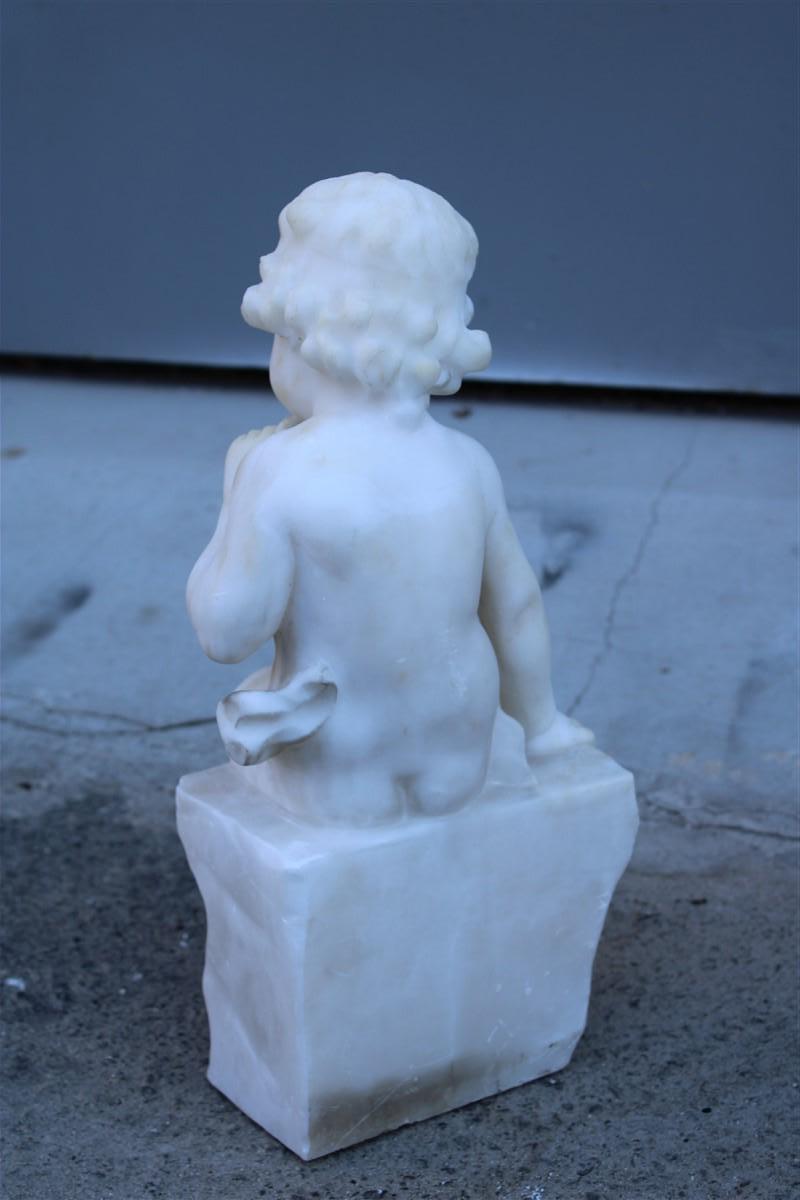 Early 20th Century Sculpture in white alabaster 1910 with a child sitting on a wall thinking For Sale