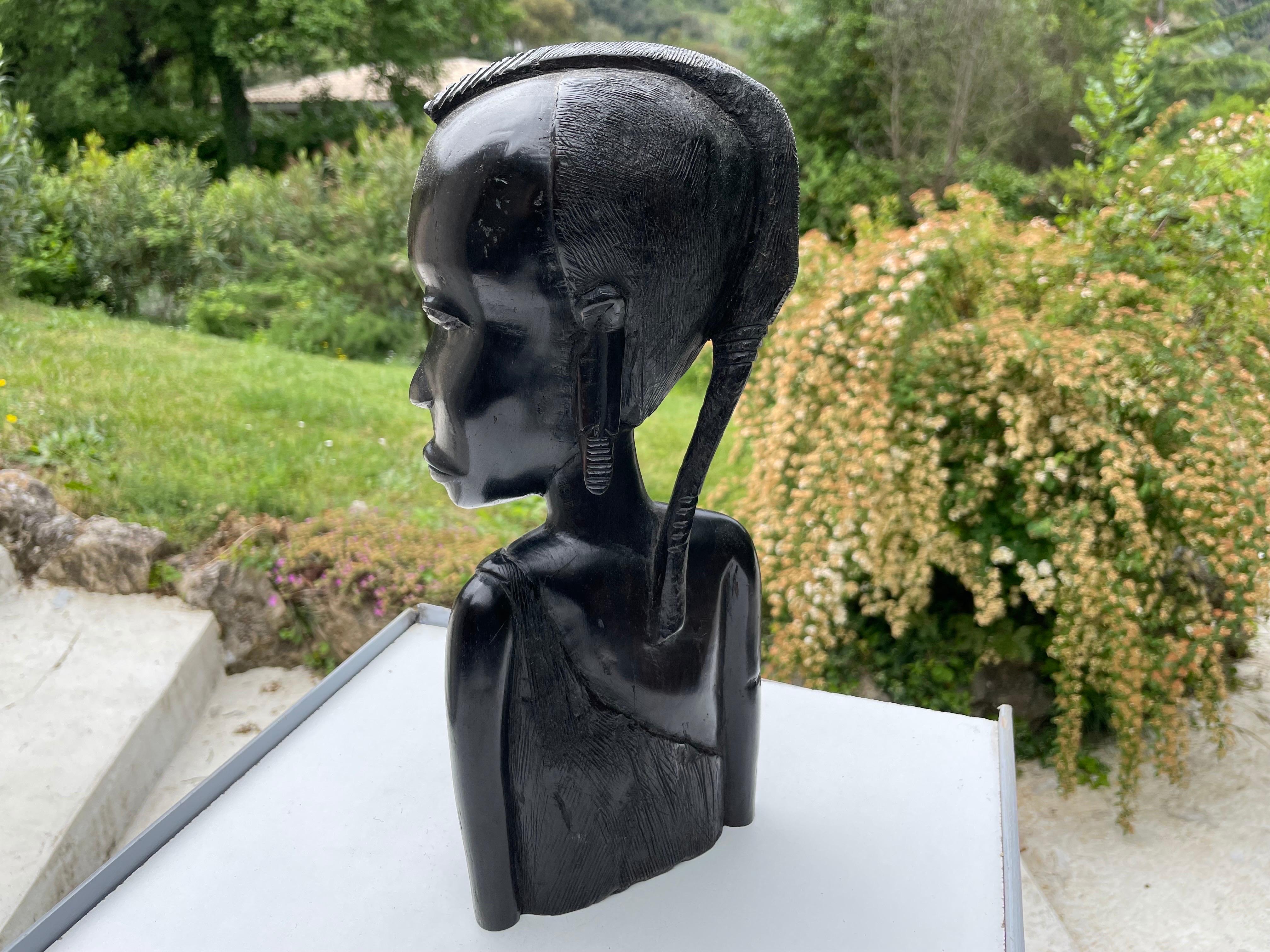 Mid-20th Century Sculpture in Wood from Africa, Bust of a Woman, in a Black Color, circa 1960 For Sale