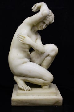 Sculpture, kneeling Venus in white marble