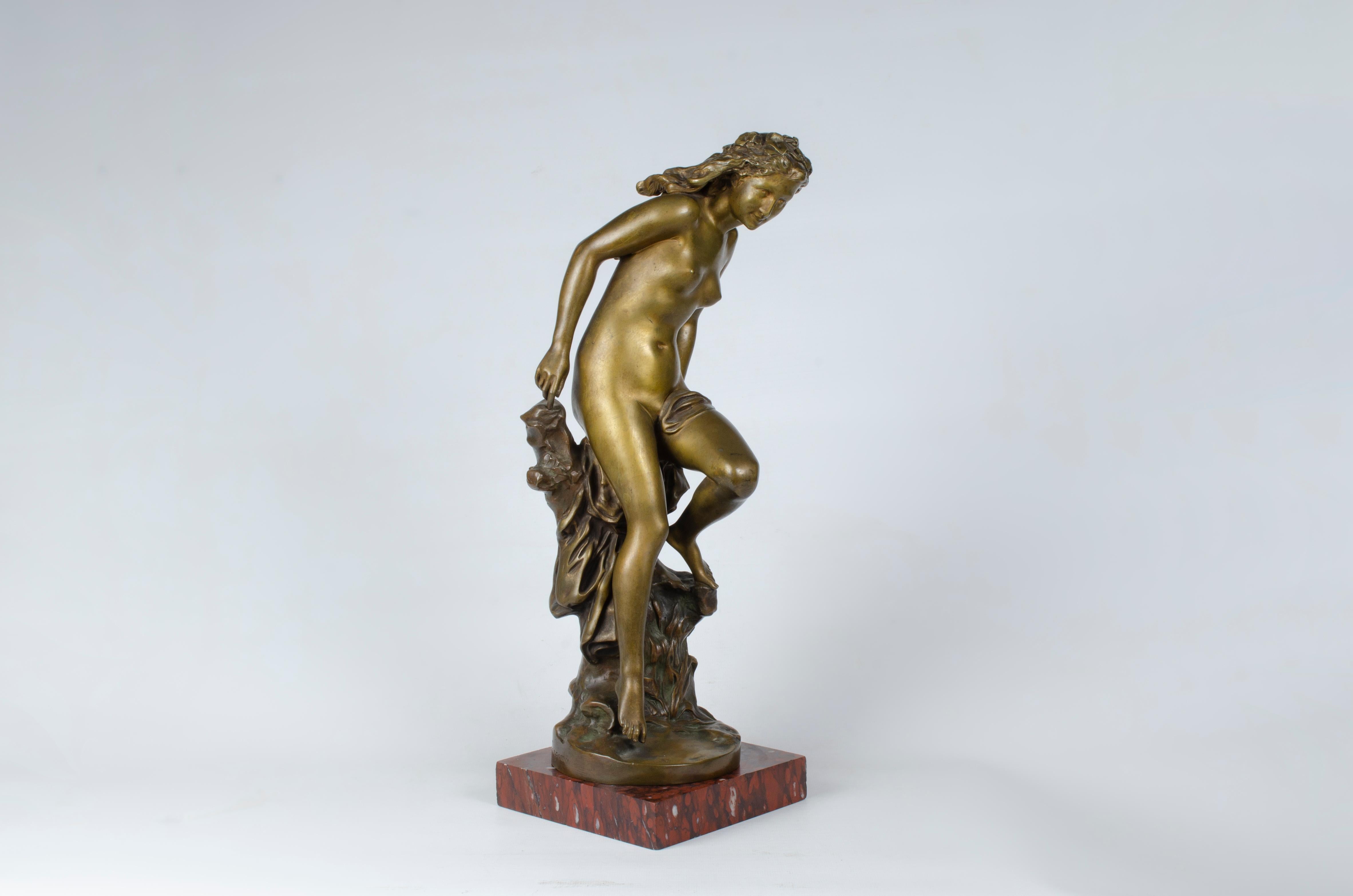 Sculpture “La Frileuse” by Jean-Baptiste Carpeaux (1827-1875). It is made of gilded bronze supported on a red marble base. Signed JB Carpeaux, P B, Susse Frères, Editeuns Paris, Susse Fres, Ed ts Paris.

France, CIRCA 1860.