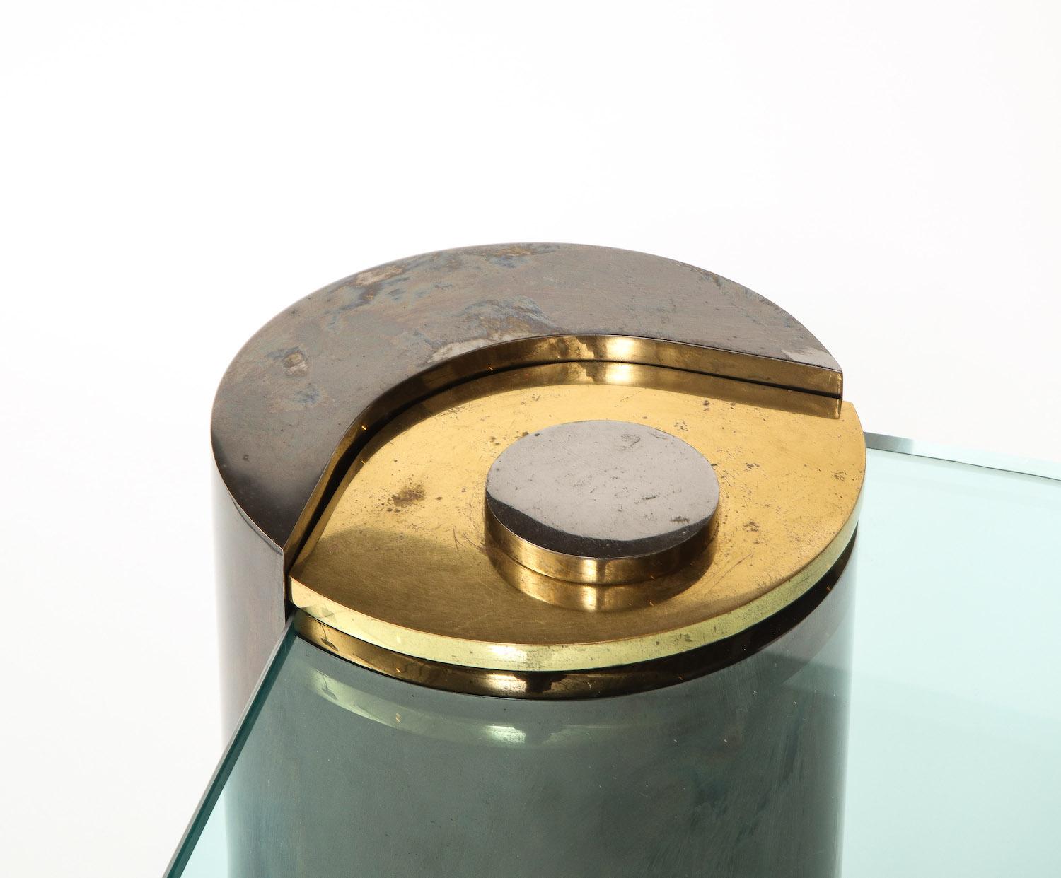 Oxidized & polished brass base with cantilevered glass top. Signed at bottom of base.