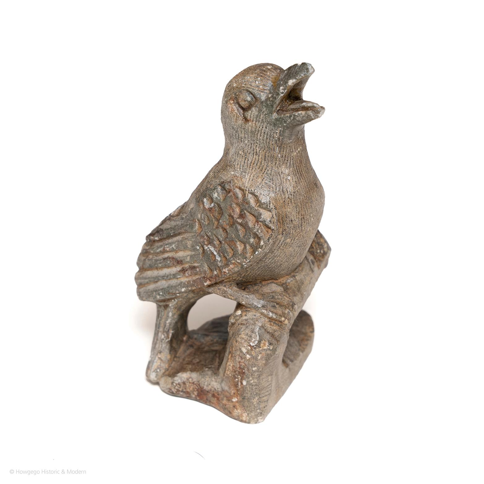 Charming sculpture of a bird perched on a bough singing.
 
Measures: length 6cm., 2 1/2