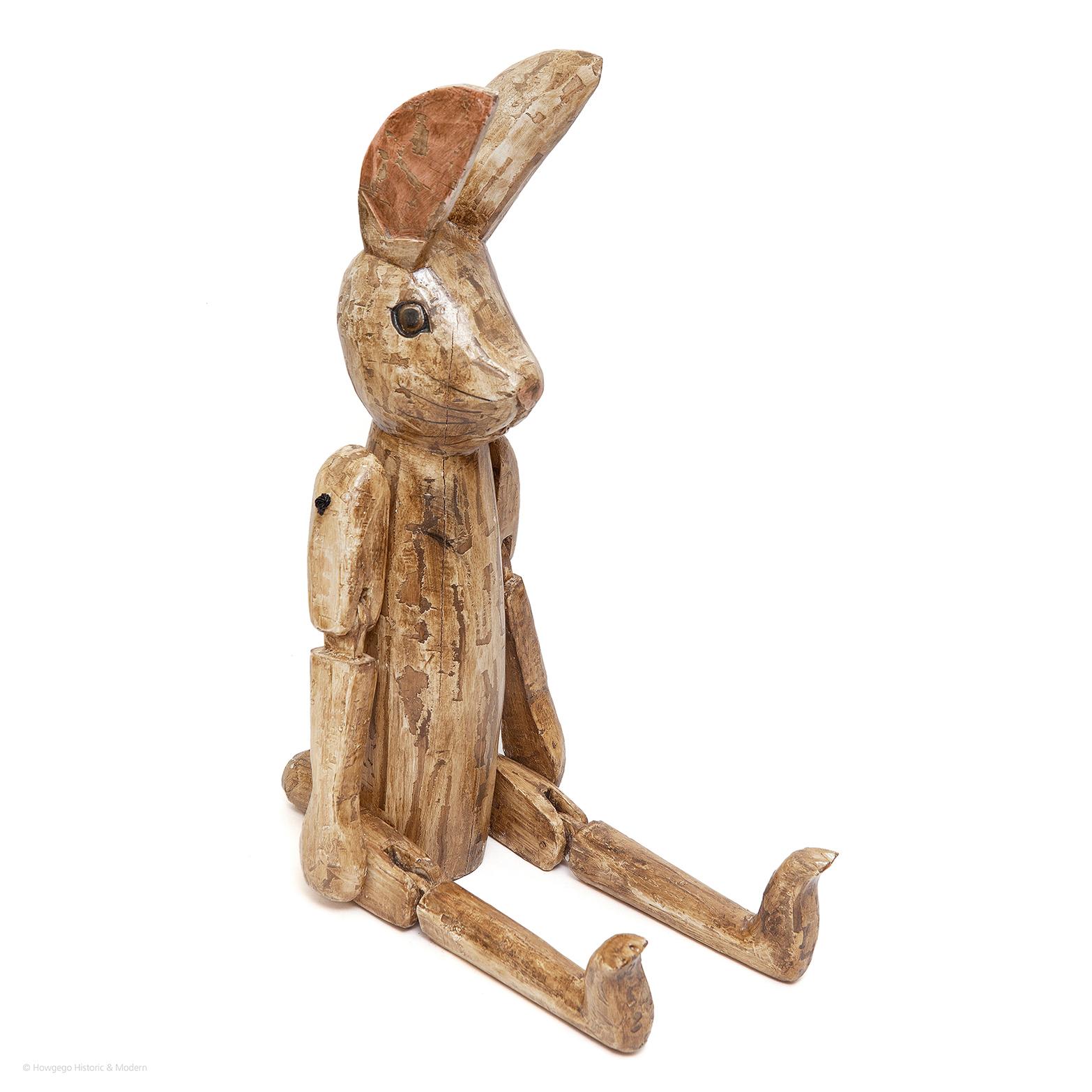 - Unusual and eclectic, most likely made as a sculptor's or artist's model. 
- This naive articulated sculpture of a rabbit has huge charm, tacticity and engaging playfulness
- Conversation piece.

Measures: Height (seated) - 48cm 
Length -