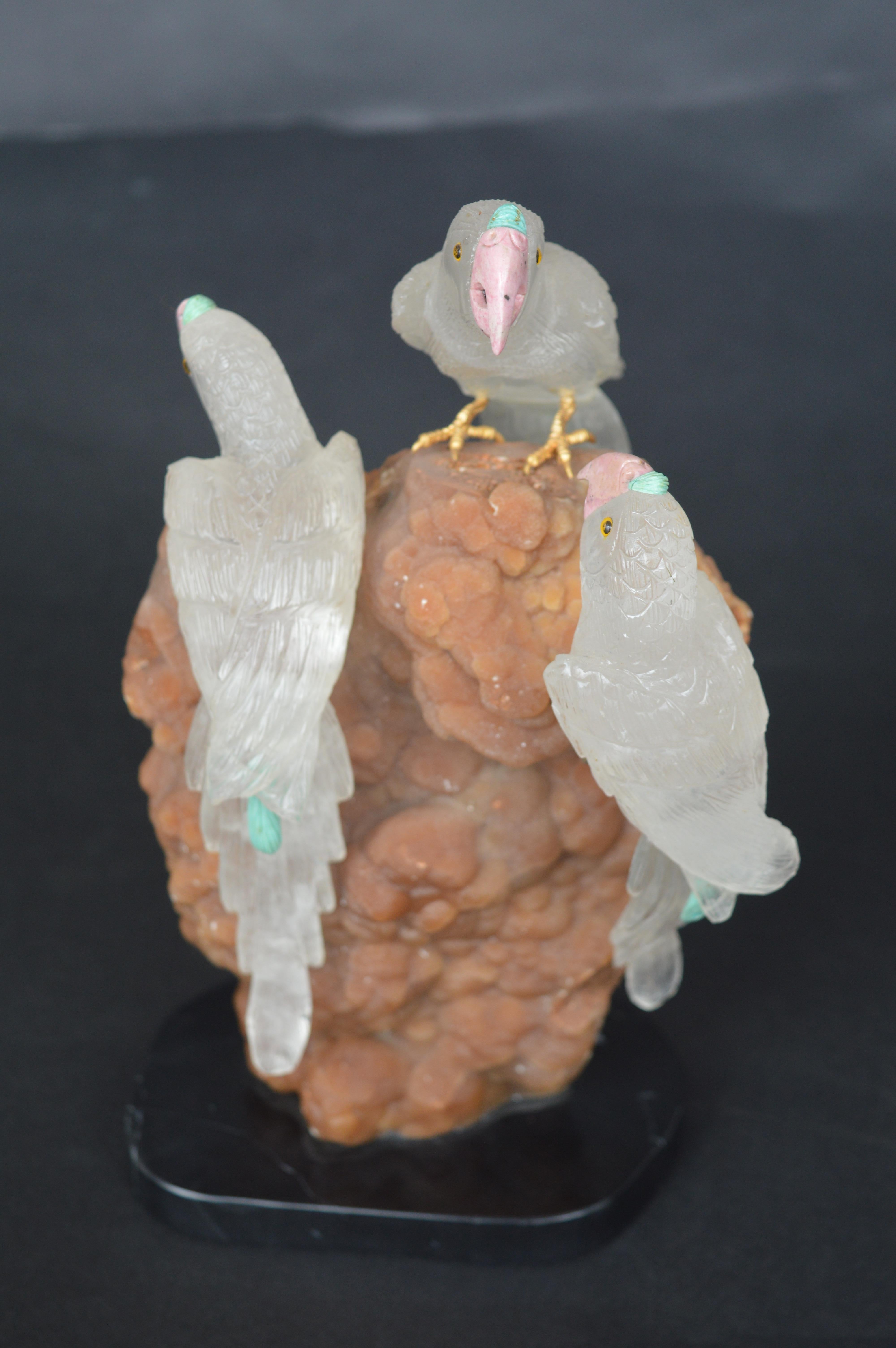 Hand carved sculpture of 3 rock crystal parakeets.