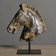 Sculpture of a Black Horse's Head.