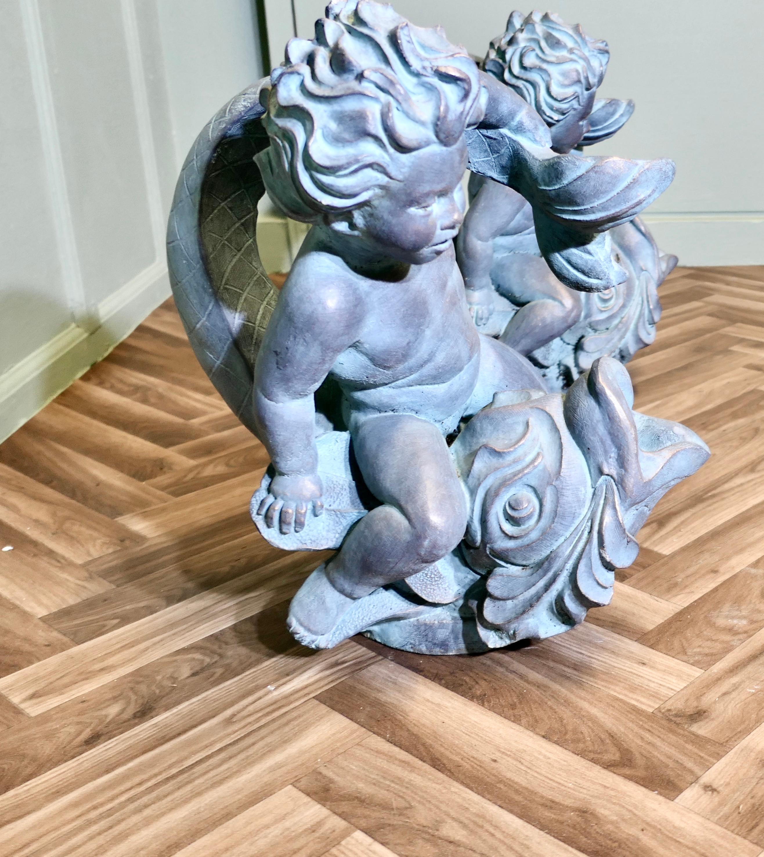 Sculpture of a Cherub Riding a Fish Fountain Water Feature (2 Available) In Good Condition For Sale In Godshill, Isle of Wight