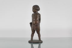 Sculpture of a child with arrows in solid bronze signed. 1920s