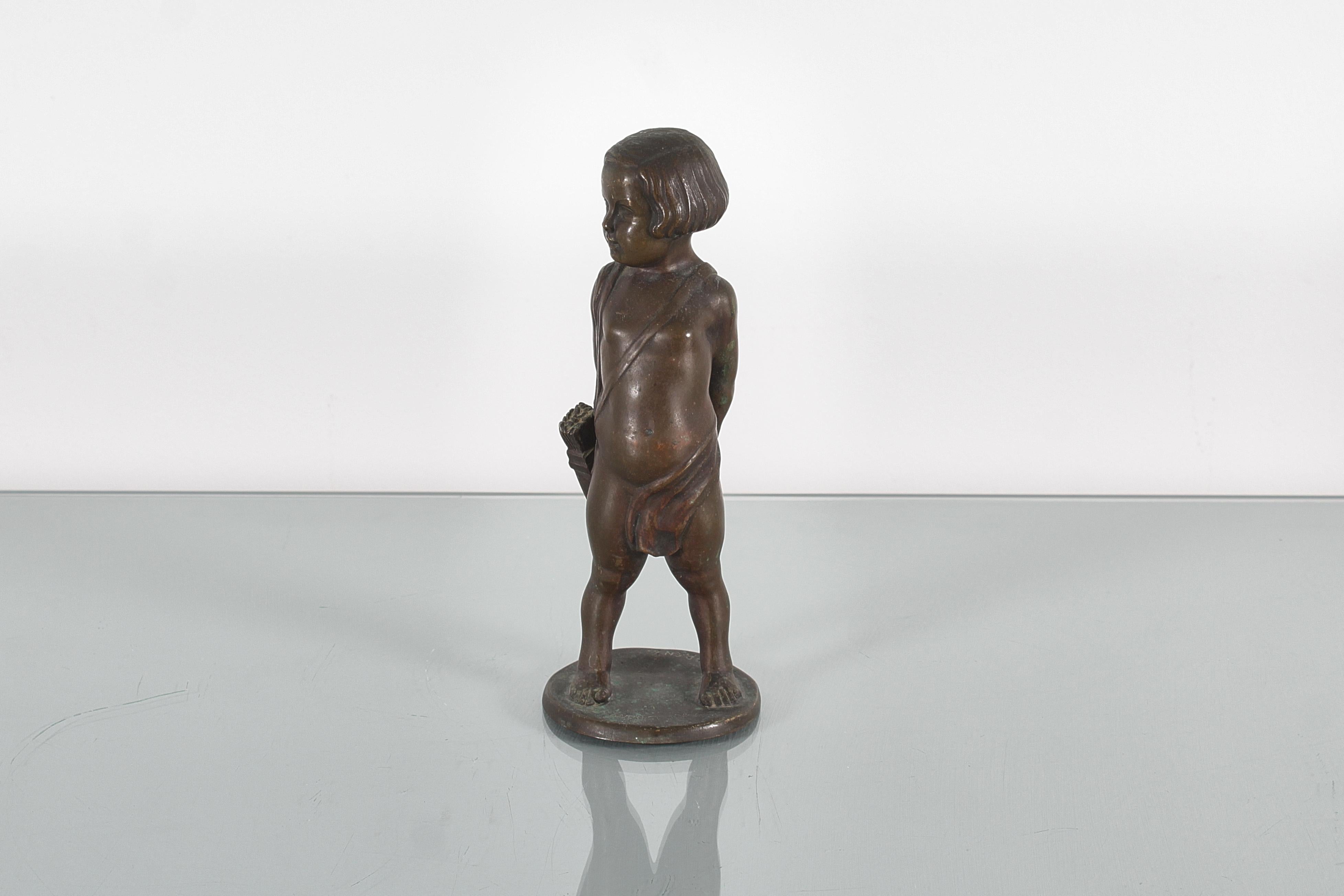 Modern Sculpture of a child with arrows in solid bronze signed. 1920s For Sale