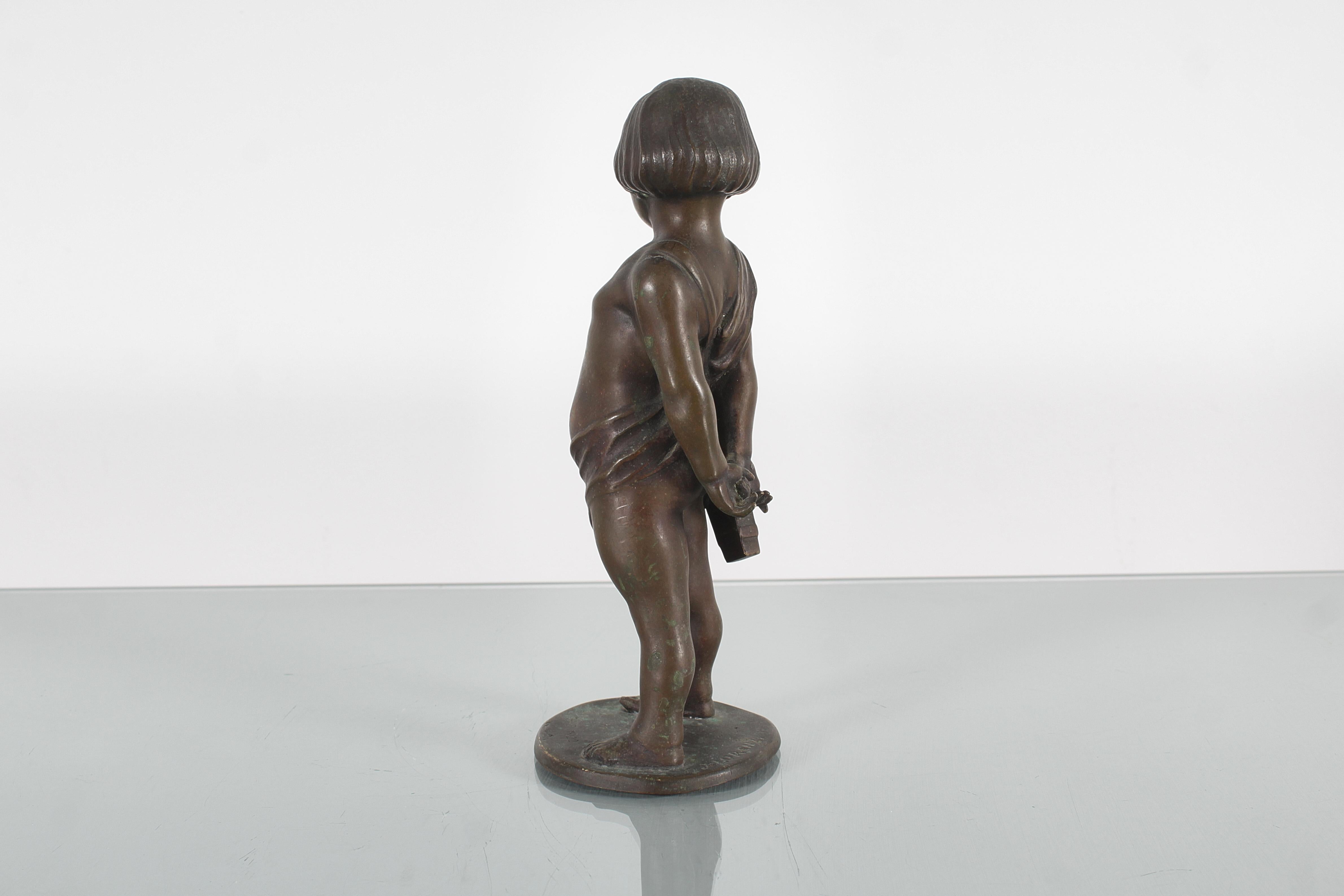 Bronze Sculpture of a child with arrows in solid bronze signed. 1920s For Sale