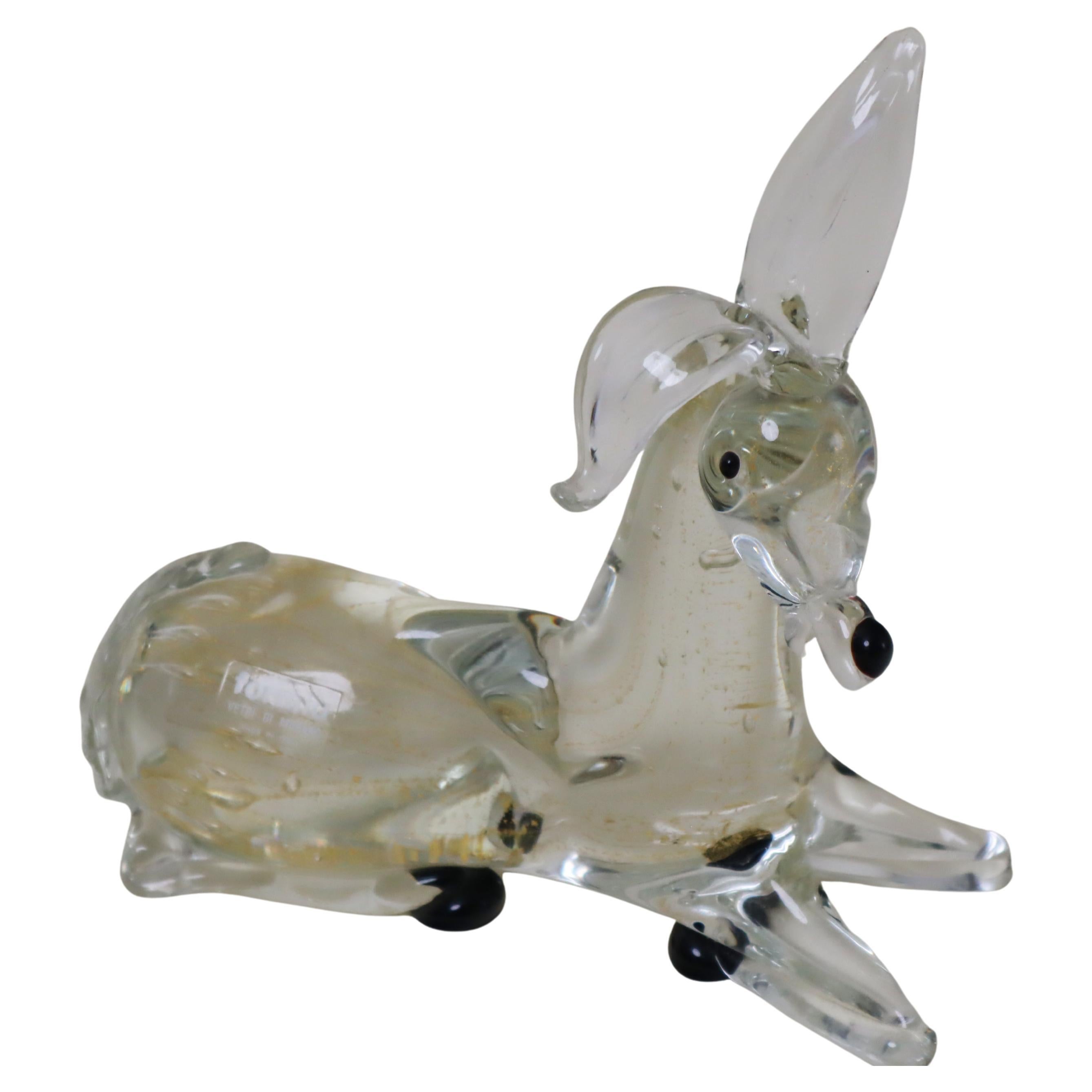 Sculpture d
un âne en verre de Murano avec poussière d
or