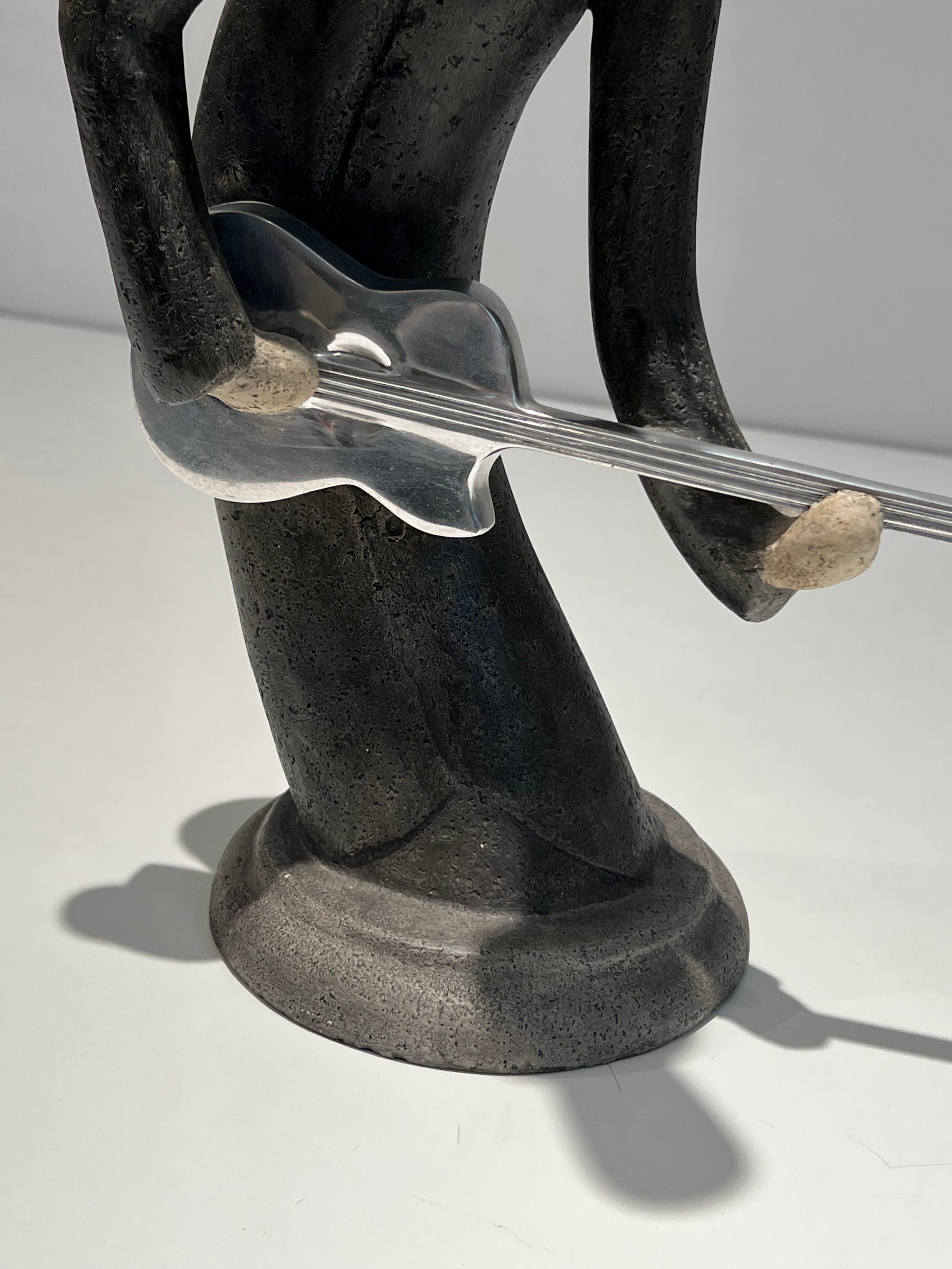 Escultura de un guitarrista en venta 10