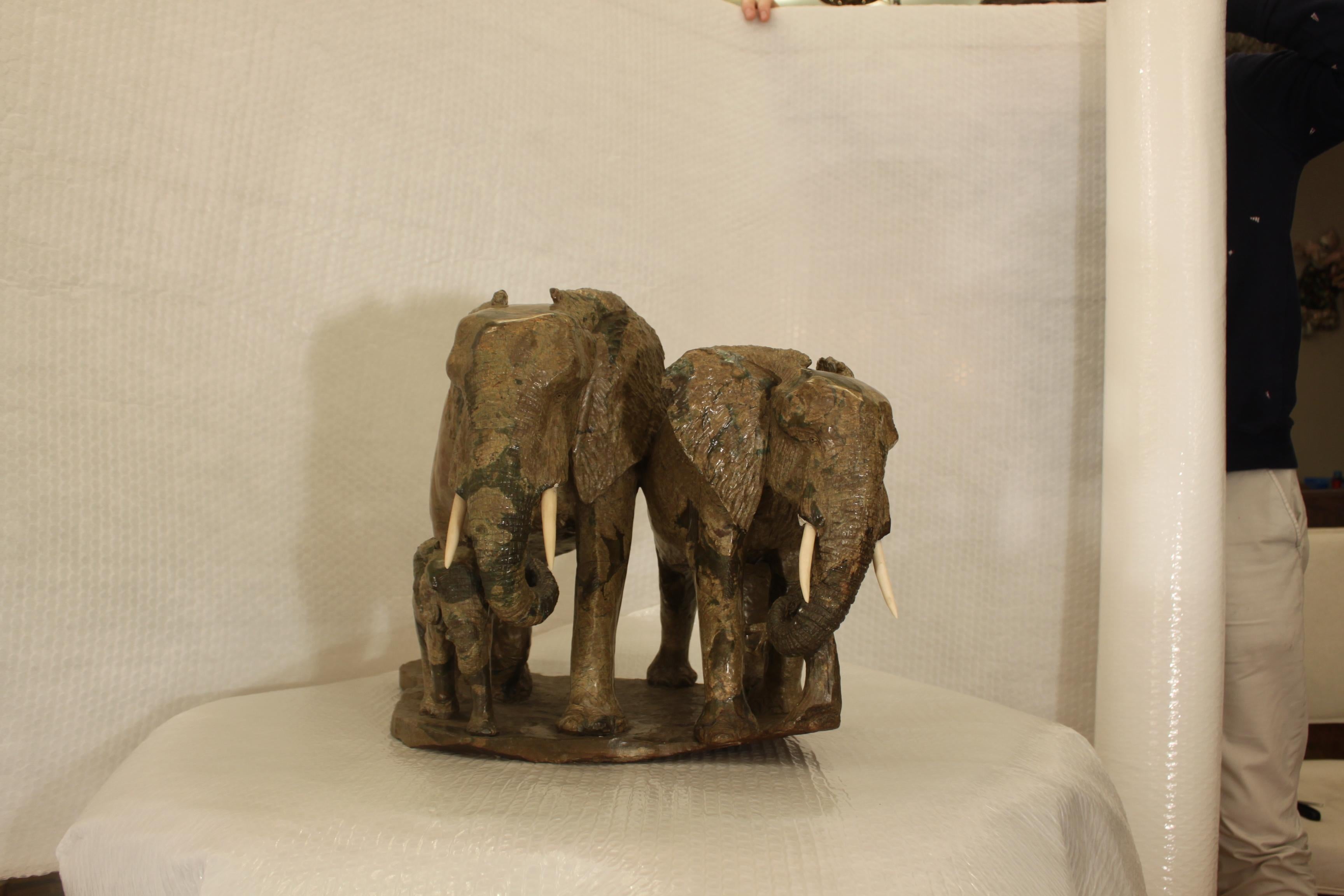 Lovely  marble elephant family, father, mother and baby. Made of Verdite - a type of green metamorphic rock largely made up of fuchsite and fine grain clay.  Sculptors mark in the stonework. 