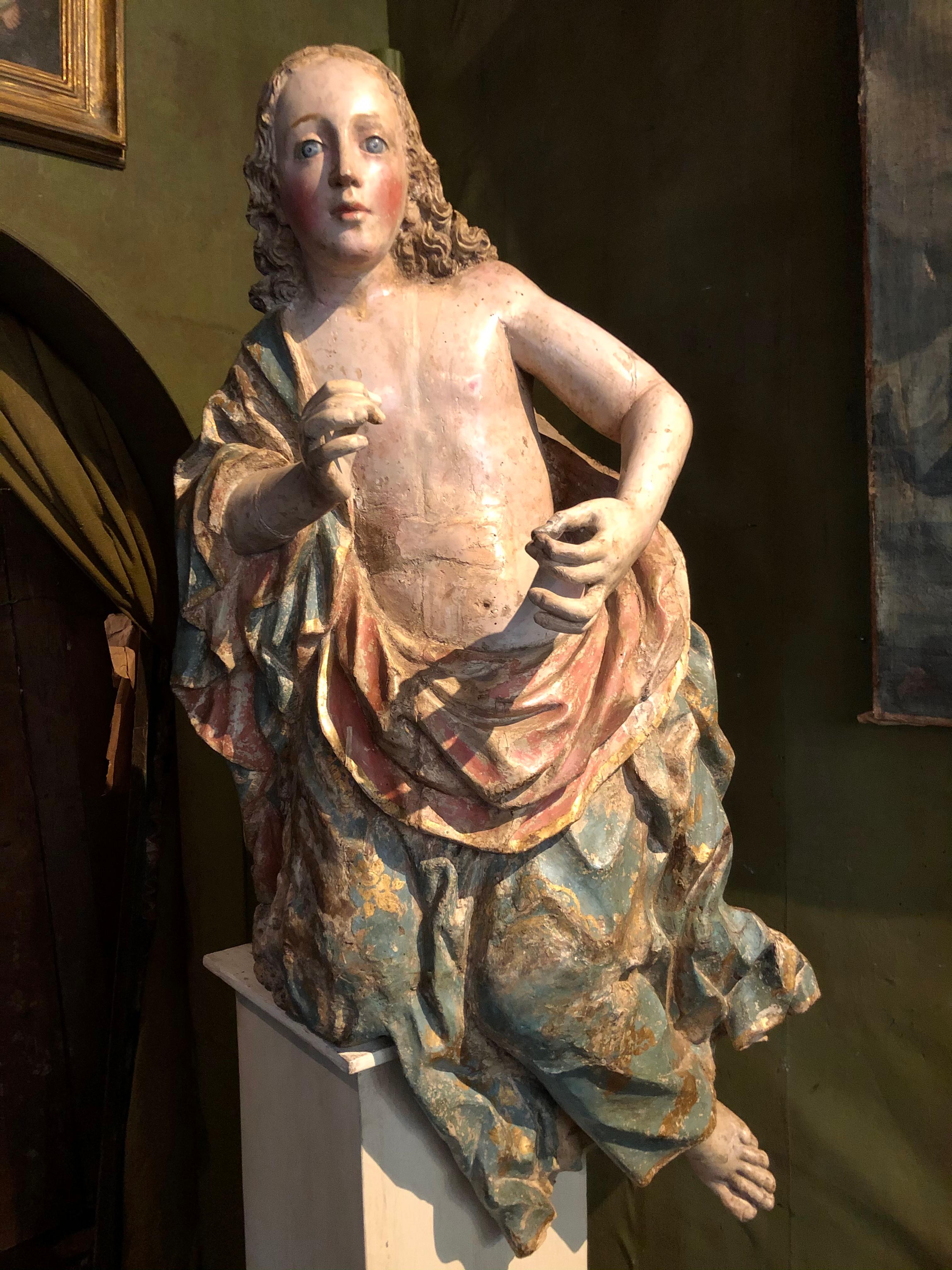 Spanish Sculpture of a Polychrome Carved Wooden Angel For Sale