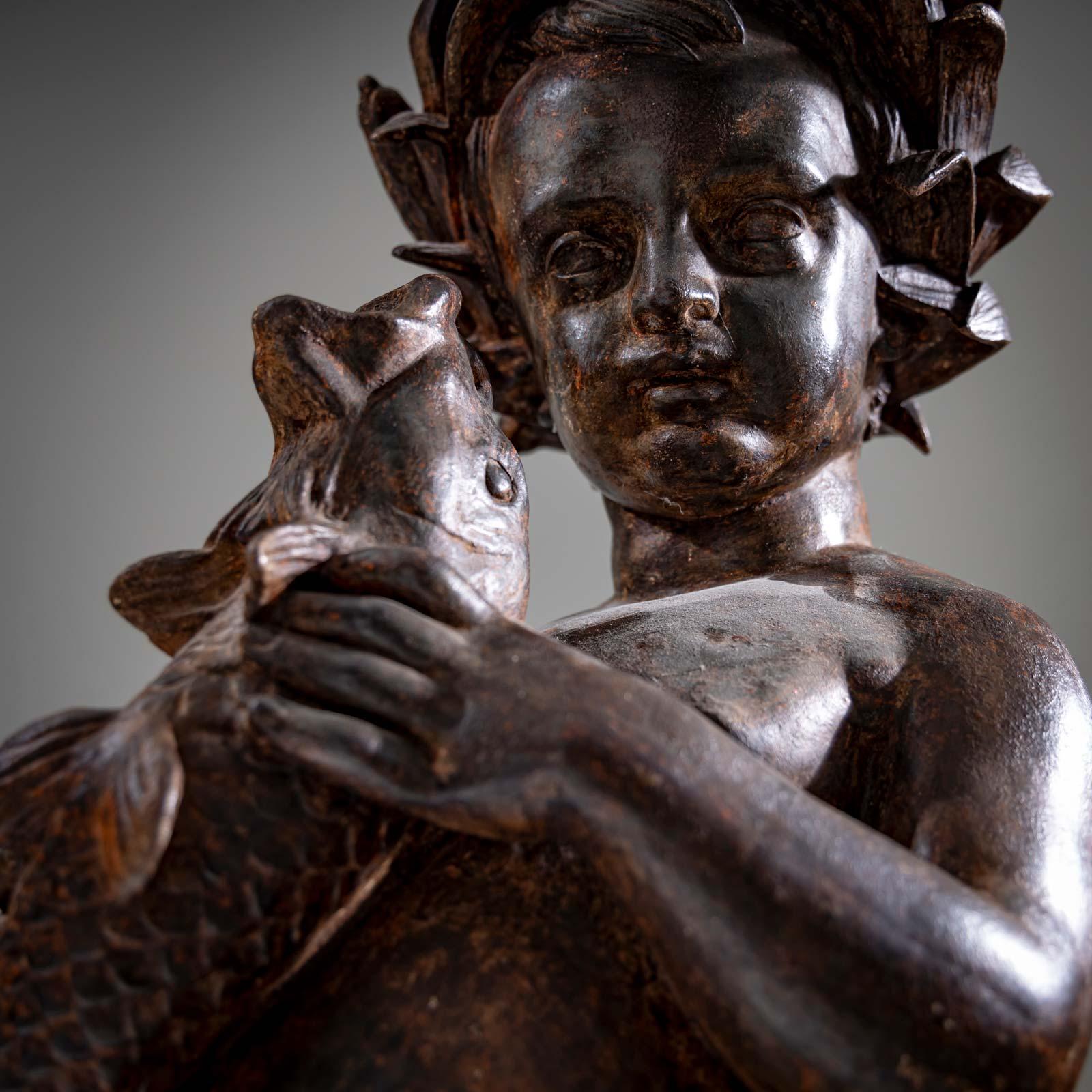 Fer Sculpture d'une Putti en Verseau, début du 20e siècle en vente