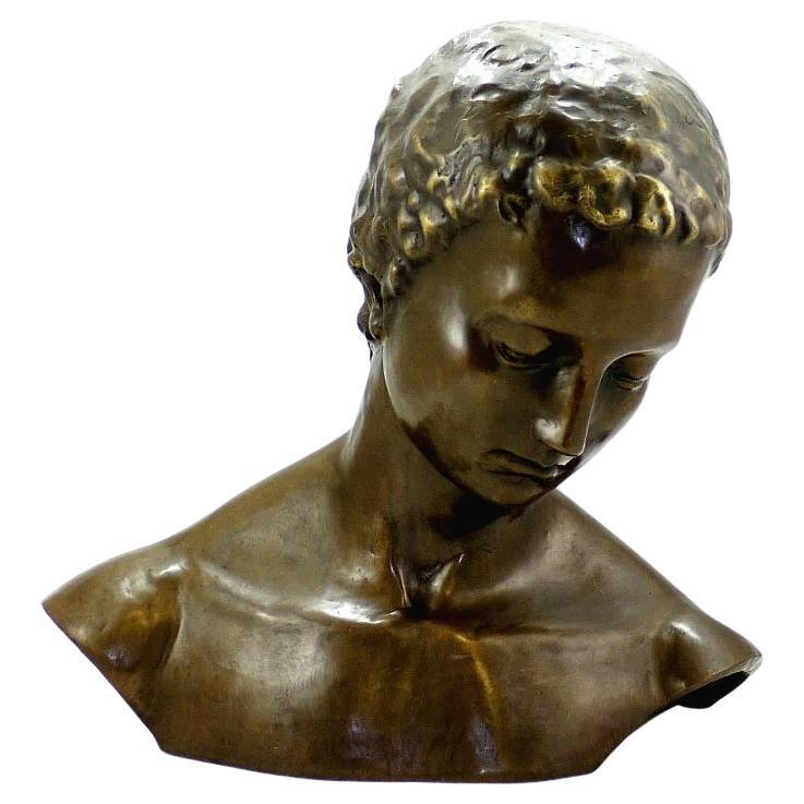 Escultura de rostro inclinado en bronce patinado, Arte contemporáneo, Siglo XXI.