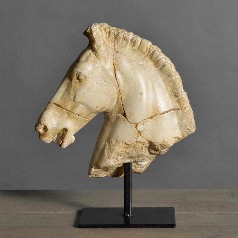 Sculpture of a white horse's head.

This sculpture, taken from an original bronze statue created by Monti in the early 19th century, reveals all the animal's finesse and power.
This handmade piece has been aged and patinated by hand.

Material: