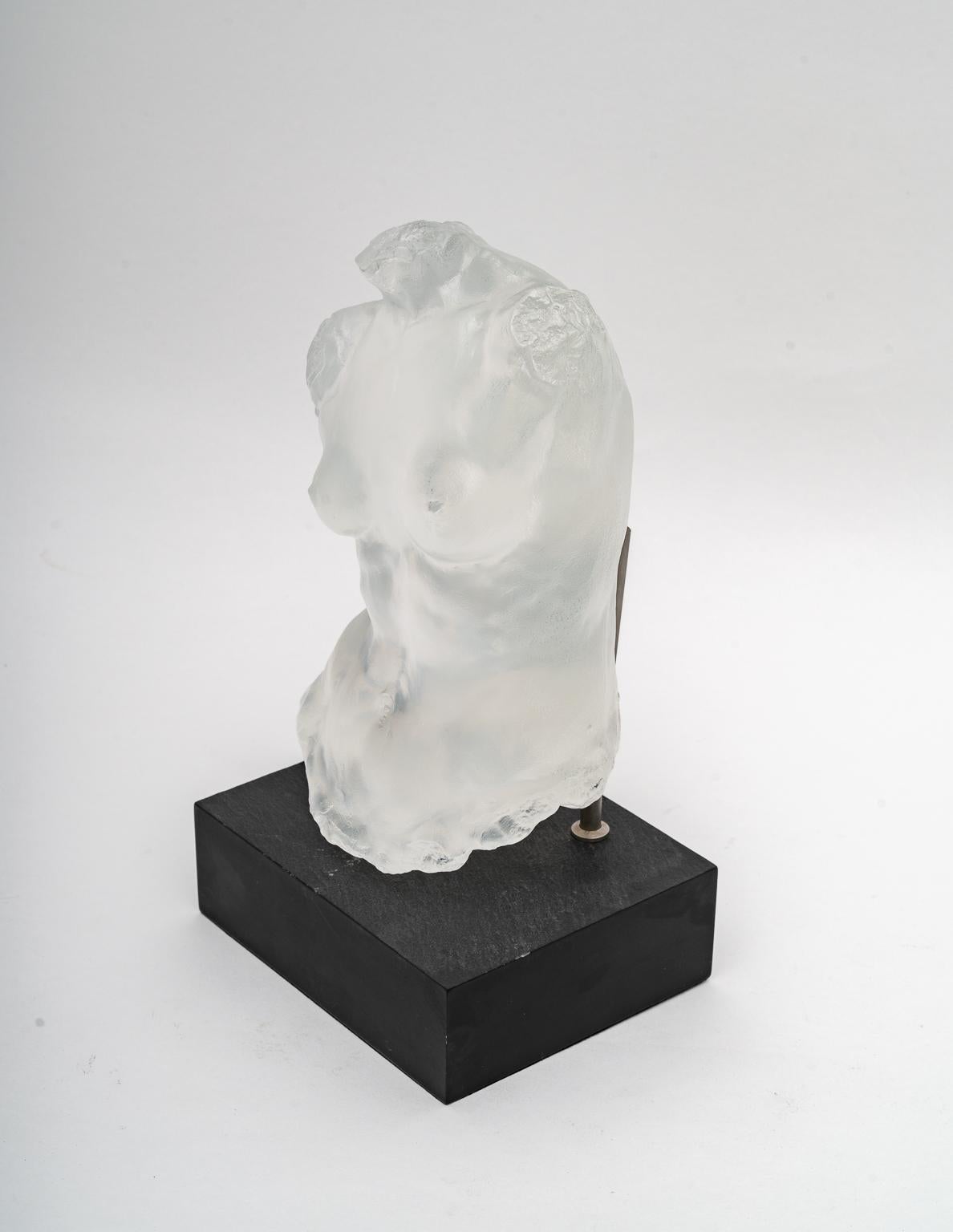 This stylish and chic sculpture of Aphrodite was acquired from a Palm Beach estate and it was created by Gary Weisman for Steuben glass and dates to the late 20th century.