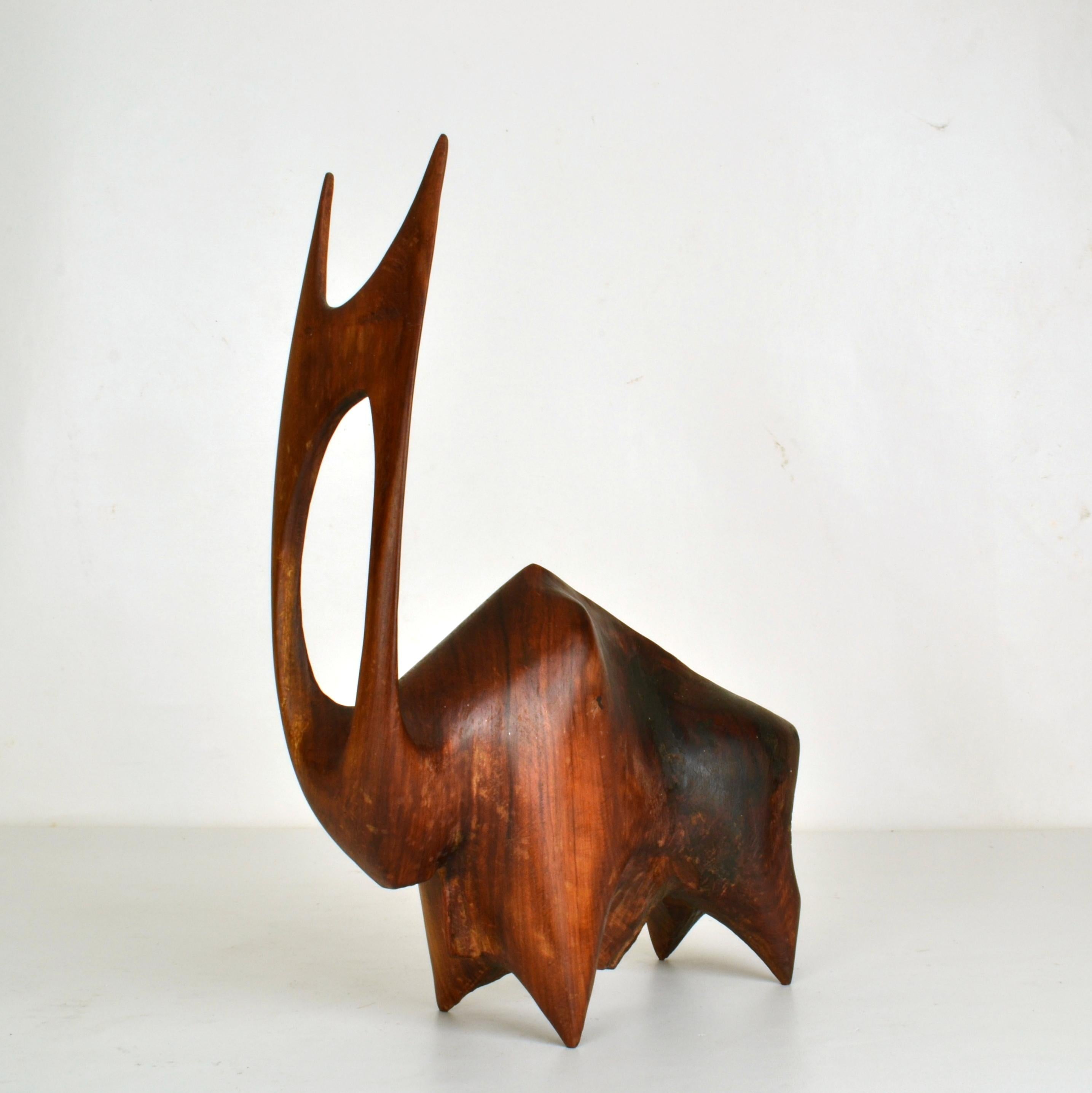 Contemporary sculpture of a large buffalo or bull emphases on the elaborate horns and powerful body. It is hand carved from hardwood circa 1970.
The water buffalo, also called the domestic water buffalo or Asian water buffalo, is a large beast