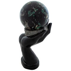 Sculpture of Marble Hand Holding Marble Ball