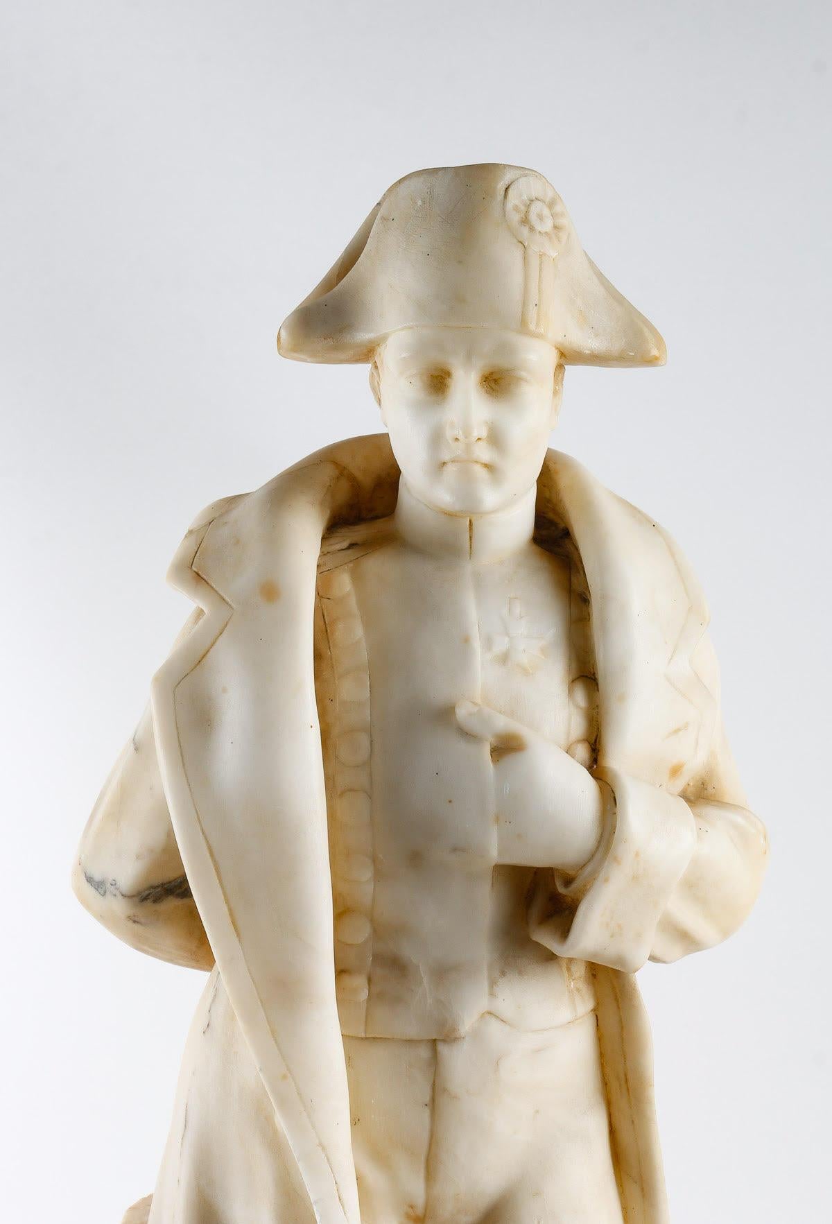 Sculpture of Napoleon in alabaster, Early 20th century.

Statue, alabaster sculpture of Napoleon, early 20th century.    
h: 65cm , w: 21cm, d: 18cm