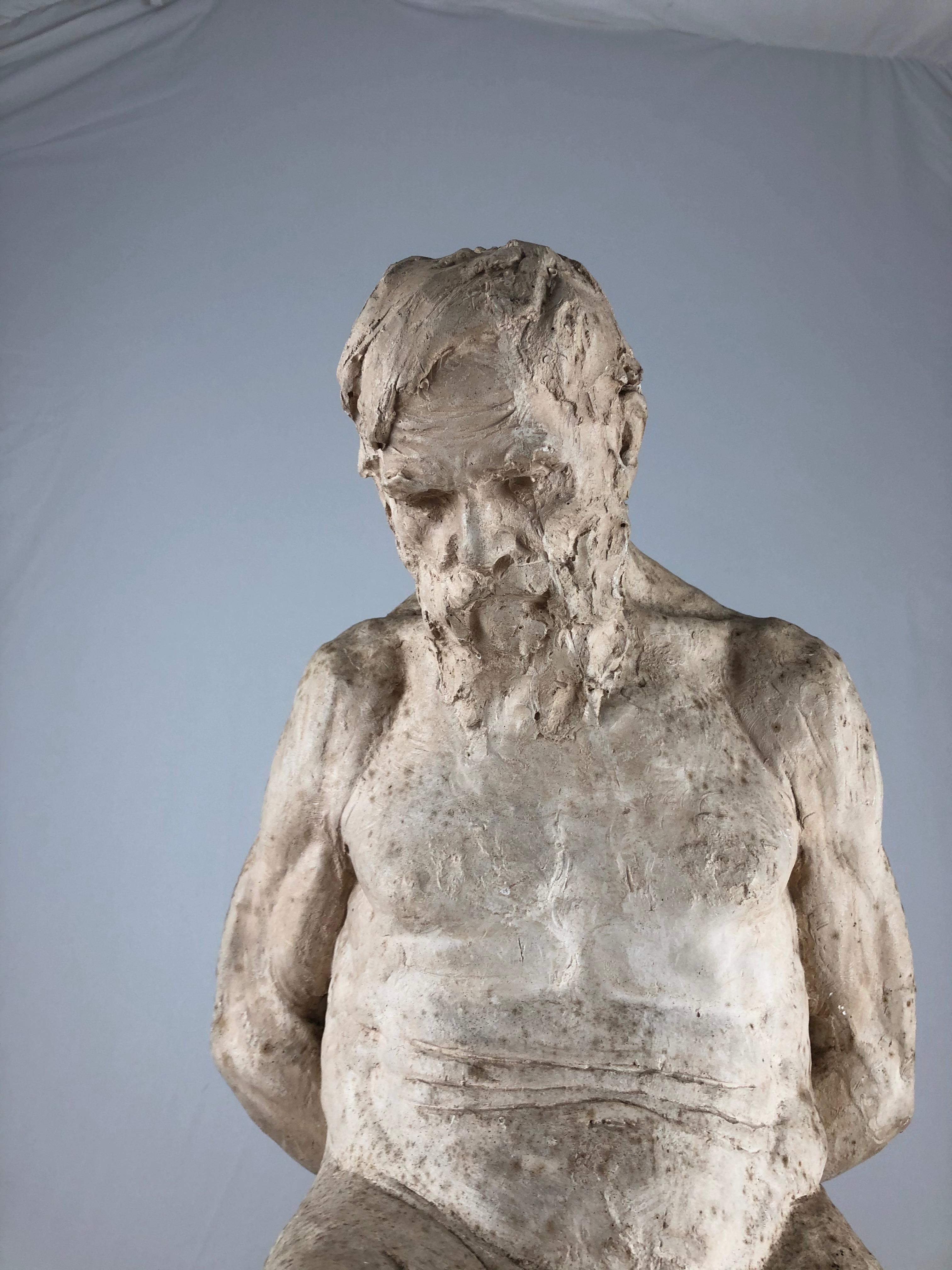 A plaster sculpture by André Vauthier-Galle (1818–1899). A seated male figure with his hands behind his back. Executed in a very realistic way. The sculpture very much reminds of Auguste Rodins 