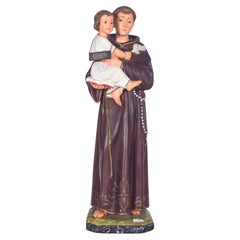Sculpture de Saint Antoine avec enfant en poterie