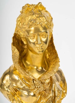 Scultura raffigurante un busto di donna in bronzo dorato di Mathurin Moreau.
