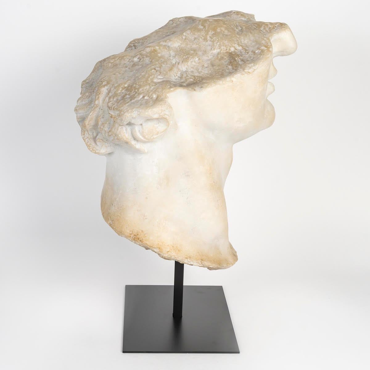 Sculpture Representing a Fragment of the Bust of Apollo. In Good Condition For Sale In Saint-Ouen, FR