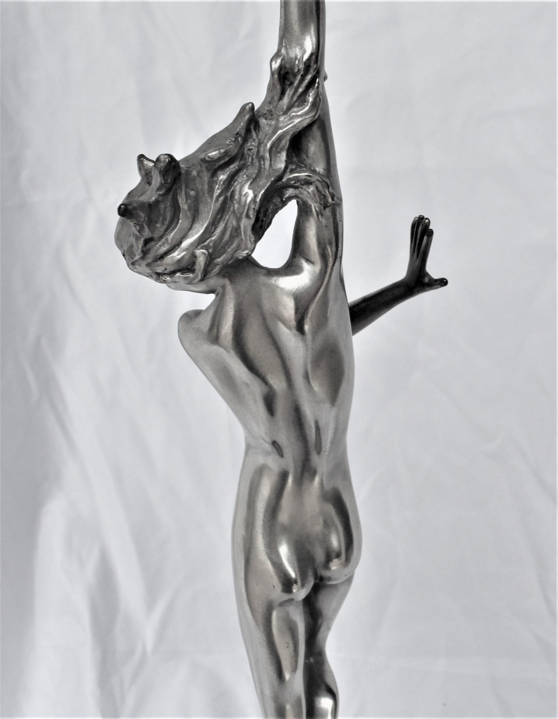 Nude female standing on top a wave. Mounted on absolute black marble base. Cast from an original, Artist is Harriet Frishmuth. Modern cast. Has the signature at the base. Famous piece not found anywhere now. Title is Crest of the Wave. This is the