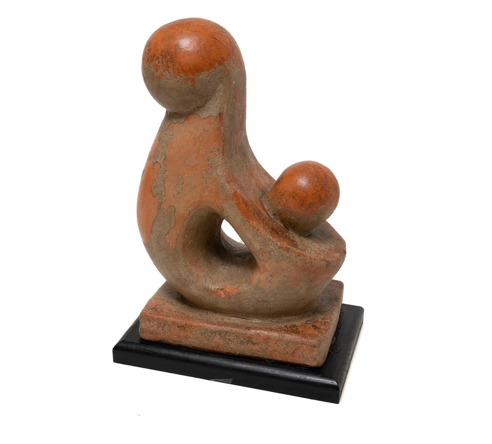 A 39cm., 15 1/4“ high, modernist, biomorphic, terracotta sculpture of a Mother & Child, mid-20th century.  Conceived with a stone finish which has partially worn away over time.  Possibly originally outside or an architectural embellishment.
Artist