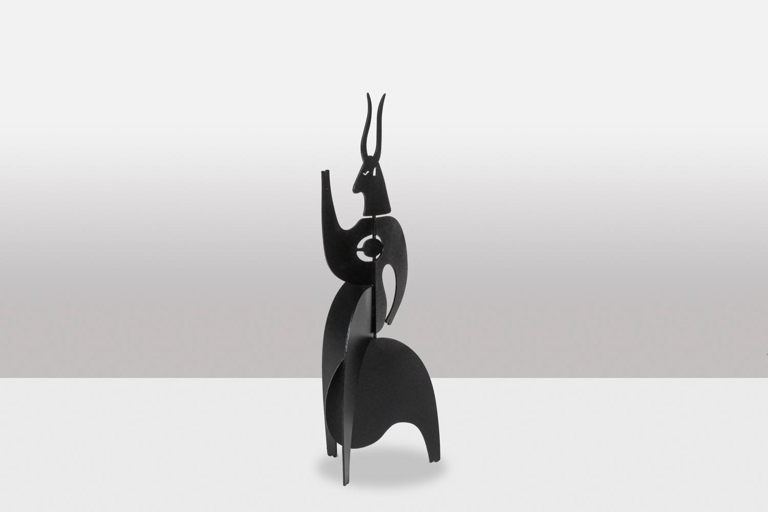 Sculpture to pose, or stabile, “Taurus” model, in black lacquered metal.

Dimensions: H 50 x D 20 cm

Contemporary artist’s work, signed and numbered.
