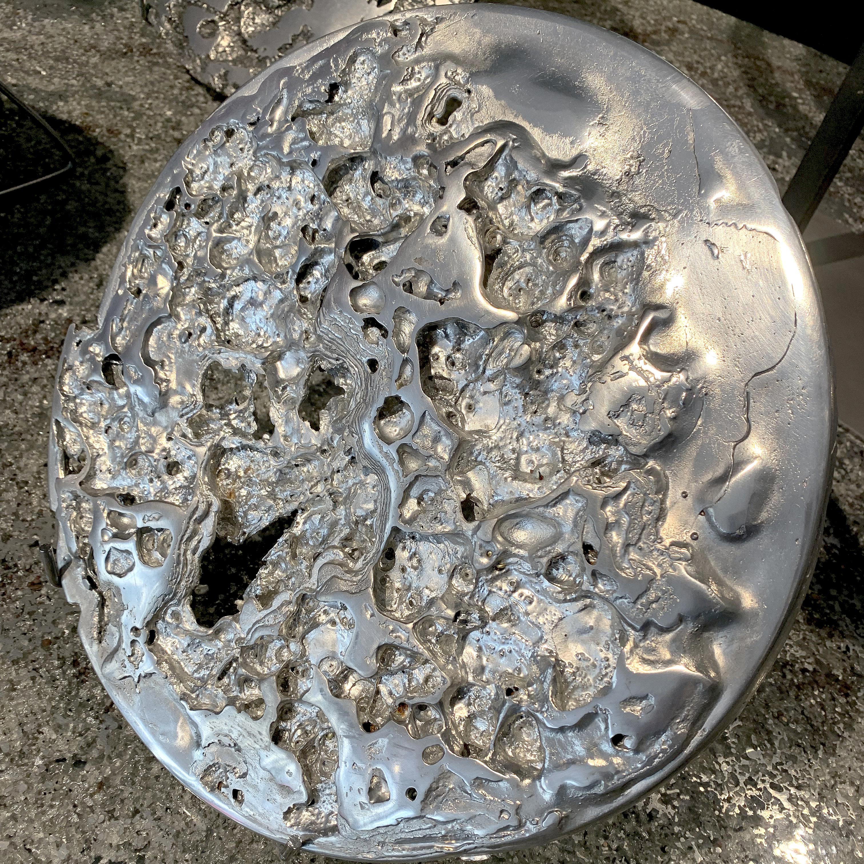 In stock: This piece of art is a pure Alchemy experimentation with pewter, made in France.
It is made of melted pewter being subjected to hot-cold thermal shock. Cooled bubbles, craters, metal lace, emerged from this secret experimentation. This is