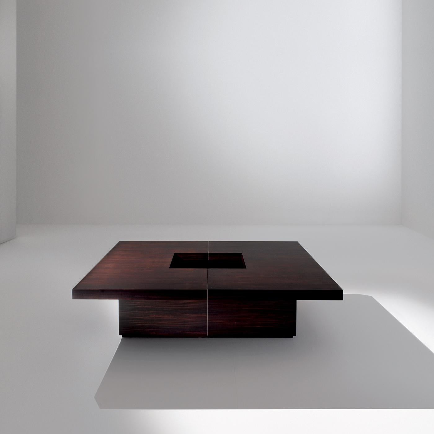 A stylish addition to any contemporary living space, the Sculptures Low Coffee Table features a 3-part wooden structure with a brushed matt lacquered finish in all wood tones and colors from the RAL color chart. The table measures 130 x 130 cm and