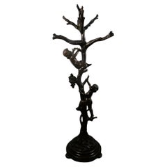 Carved wooden coat stand sculpture with tree statue and two cherubs 1900