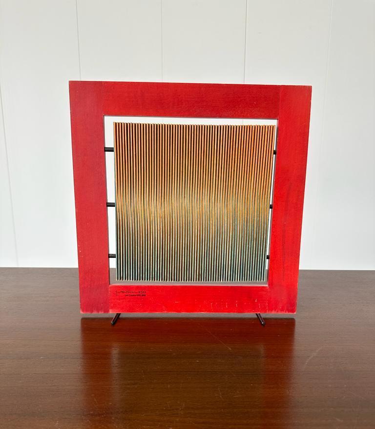 Original art sculpture designed by Gaetano Pesce; signed and dated 1963, Per Cassina 1968-1963. Red frame with lamented wood on metal feet.