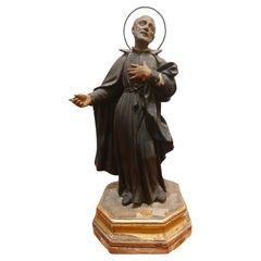 Escultura de madera lacada que representa a San Felipe Neri