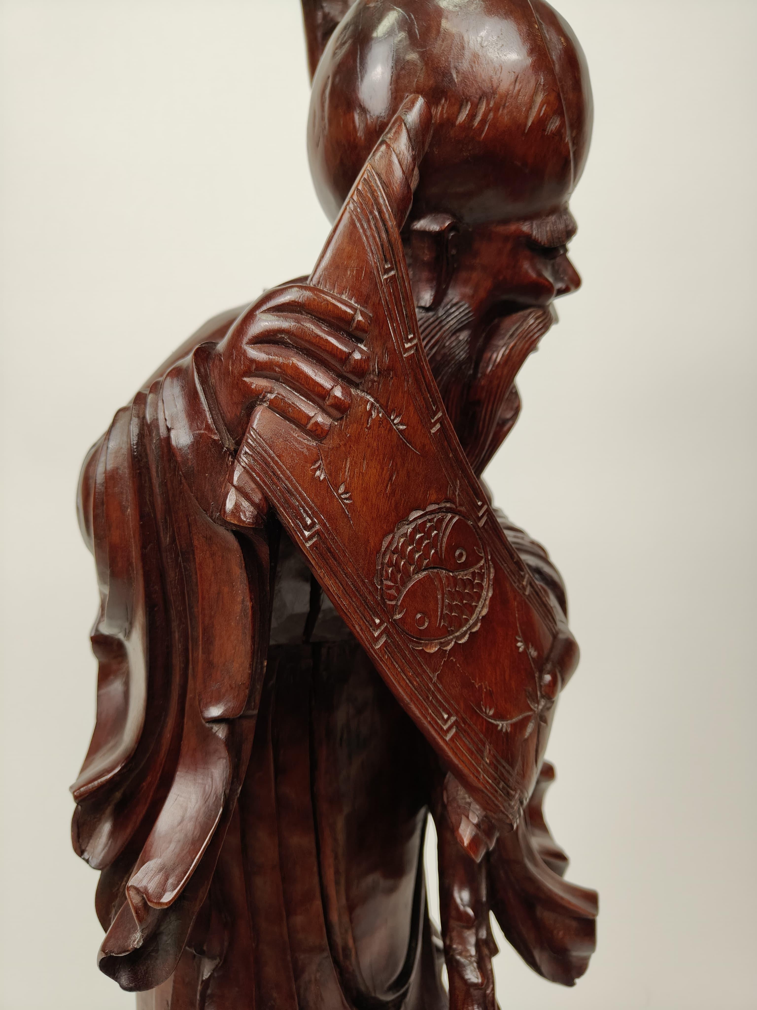 Teck Sculpture en bois de teck représentant une sauge - vers 1890, Chine en vente