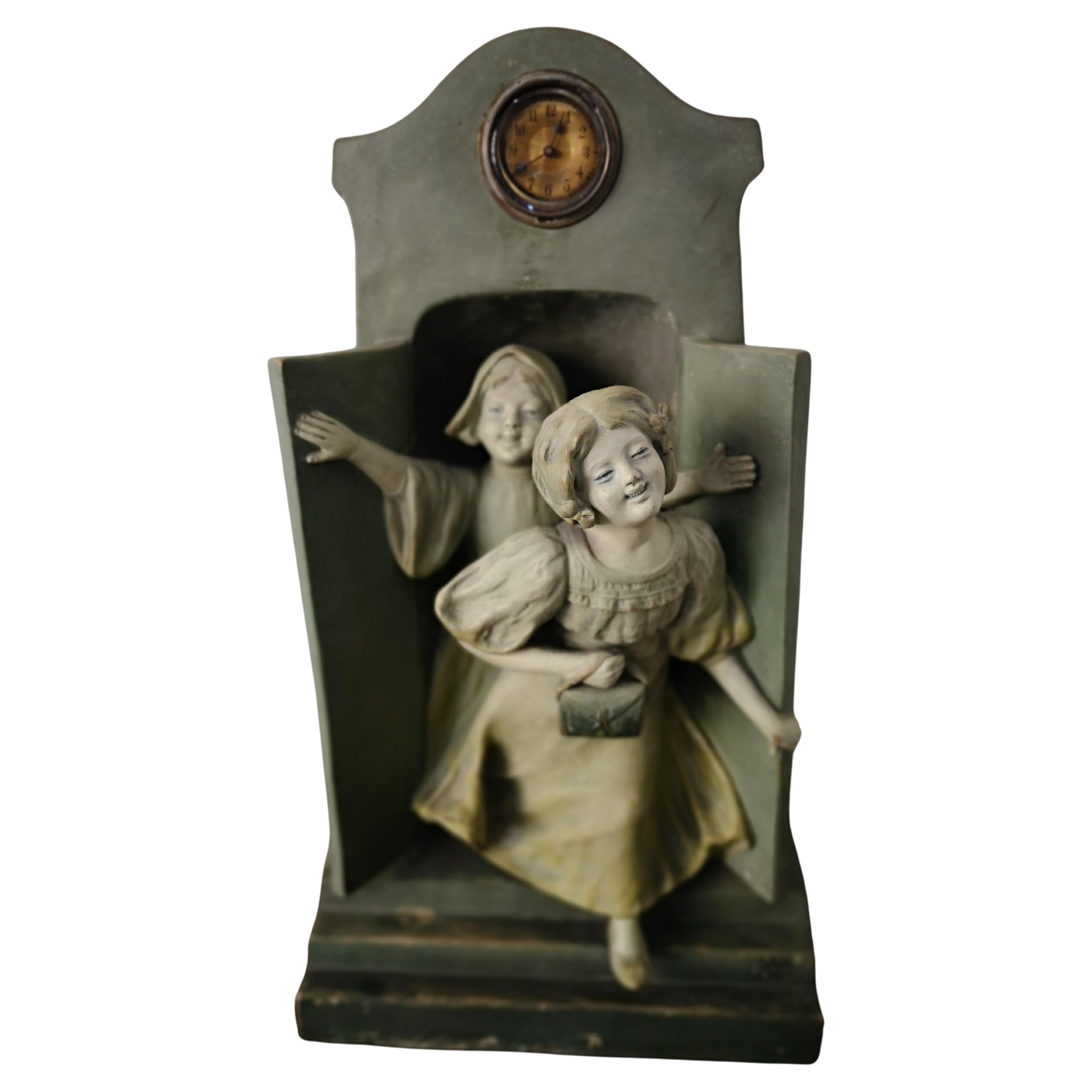 Terracotta sculpture with children and clock, late 19th century For Sale